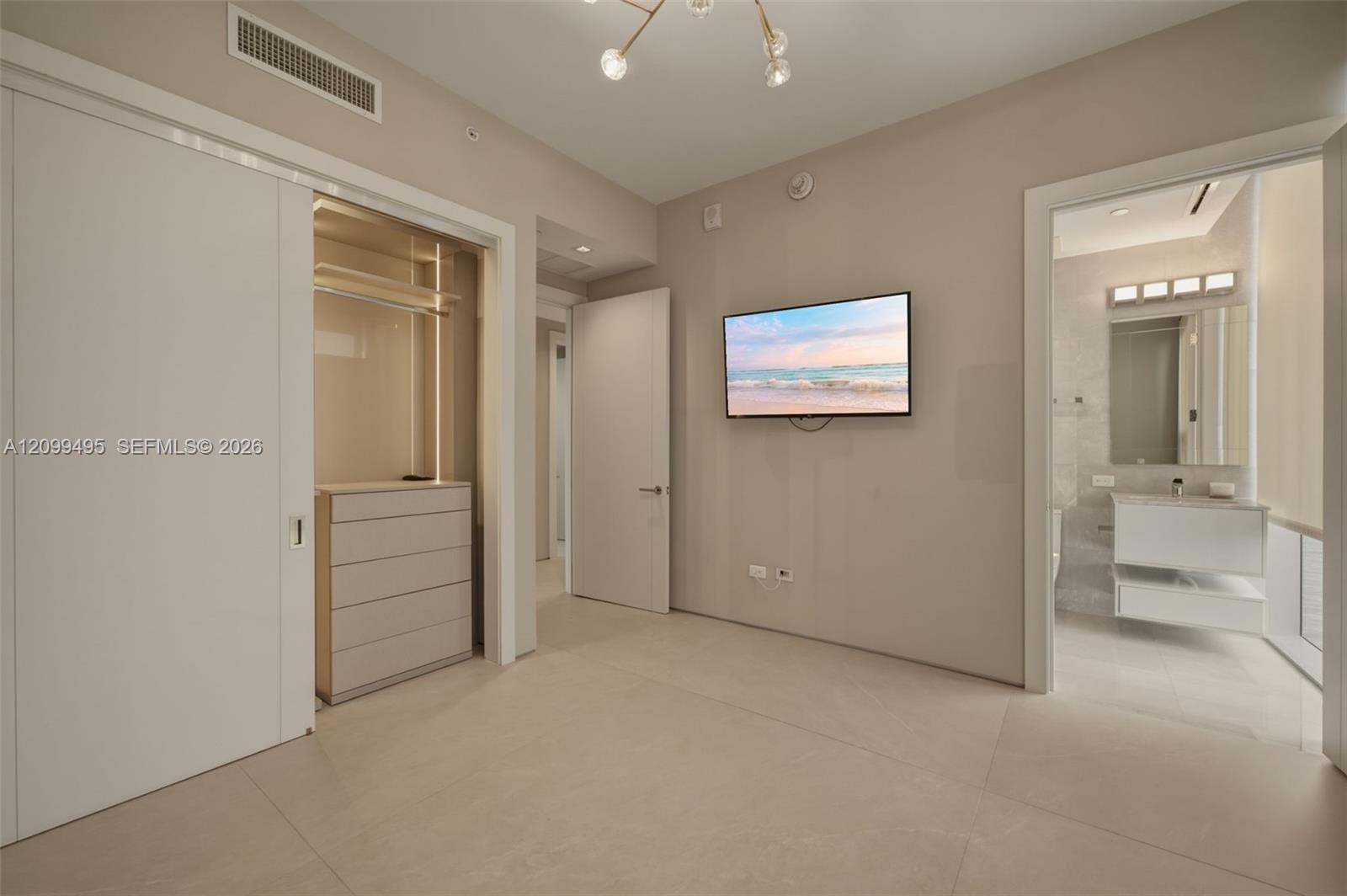 Second en-suite bedroom with custom made lighted closet.