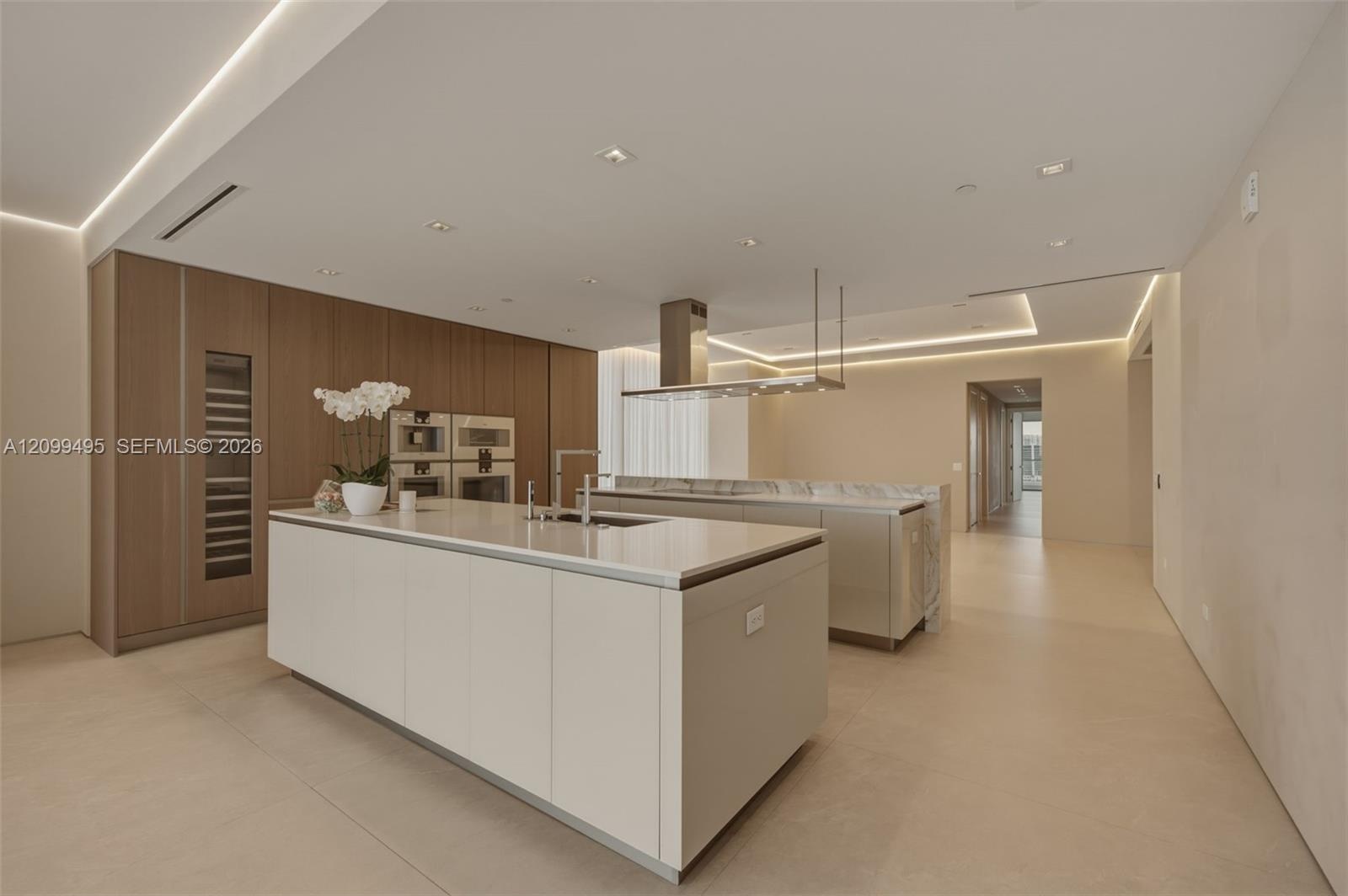 Gaggenau® appliances: warming drawer, steam oven, integrated coffee espresso/cappuccino maker and wine cellar.