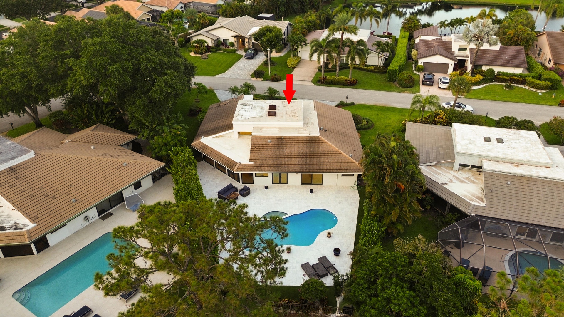 From above, the true rarity of this property comes into focus. Perfectly positioned on an oversized cul de sac lot, the home backs directly to a prote