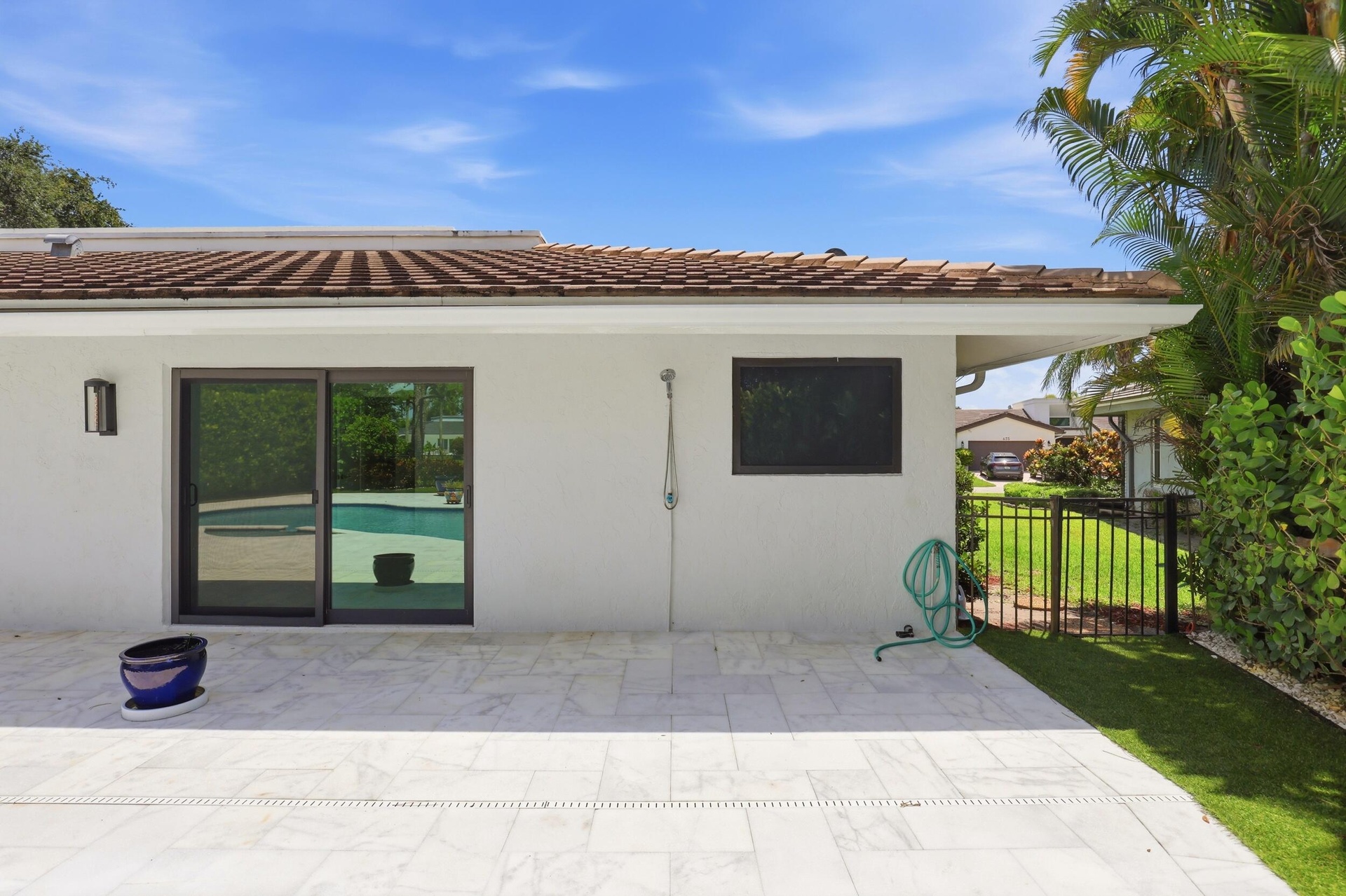 A private outdoor shower adds both convenience and a touch of resort style luxury, offering the perfect place to rinse off after a refreshing swim or 