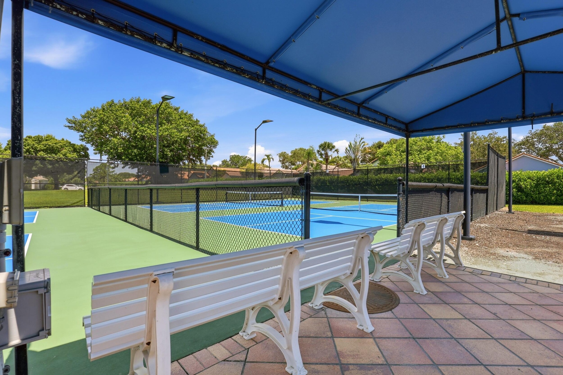 Enjoy one of the community's most popular amenities with beautifully maintained pickleball courts featuring covered seating, providing the perfect pla