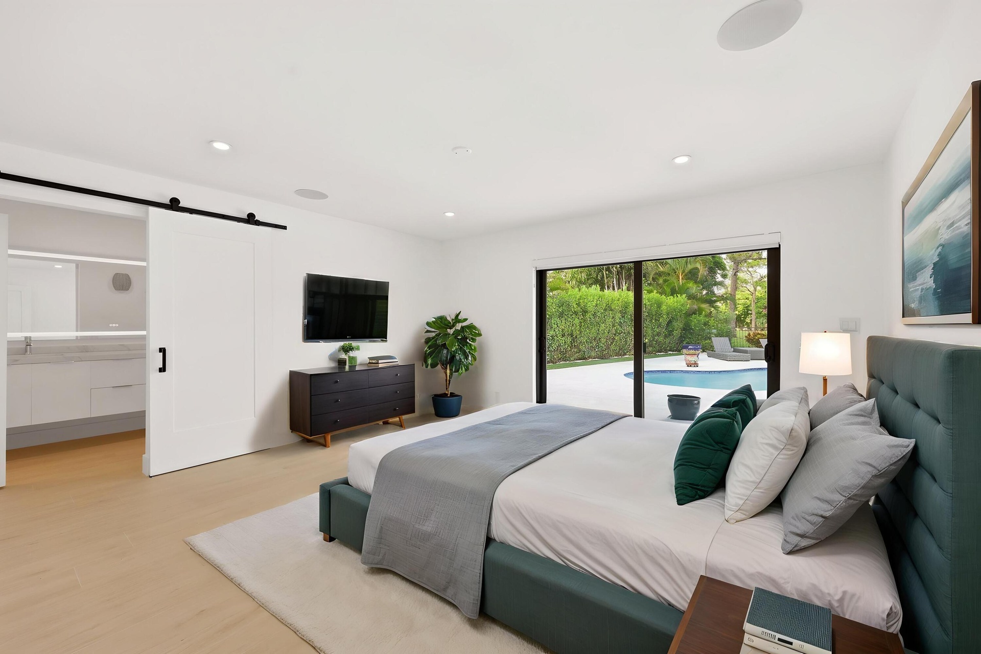 Designed as a true private guest retreat, this spacious suite offers exceptional comfort, privacy, and direct access to the backyard through oversized