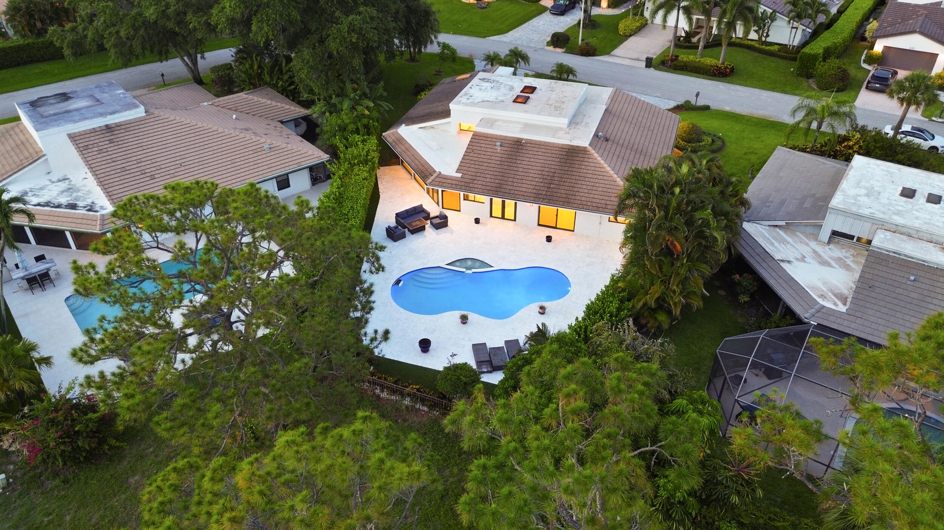 As the sun sets, this remarkable backyard transforms into a private evening retreat where luxury and nature exist in perfect harmony. Backing to a pro