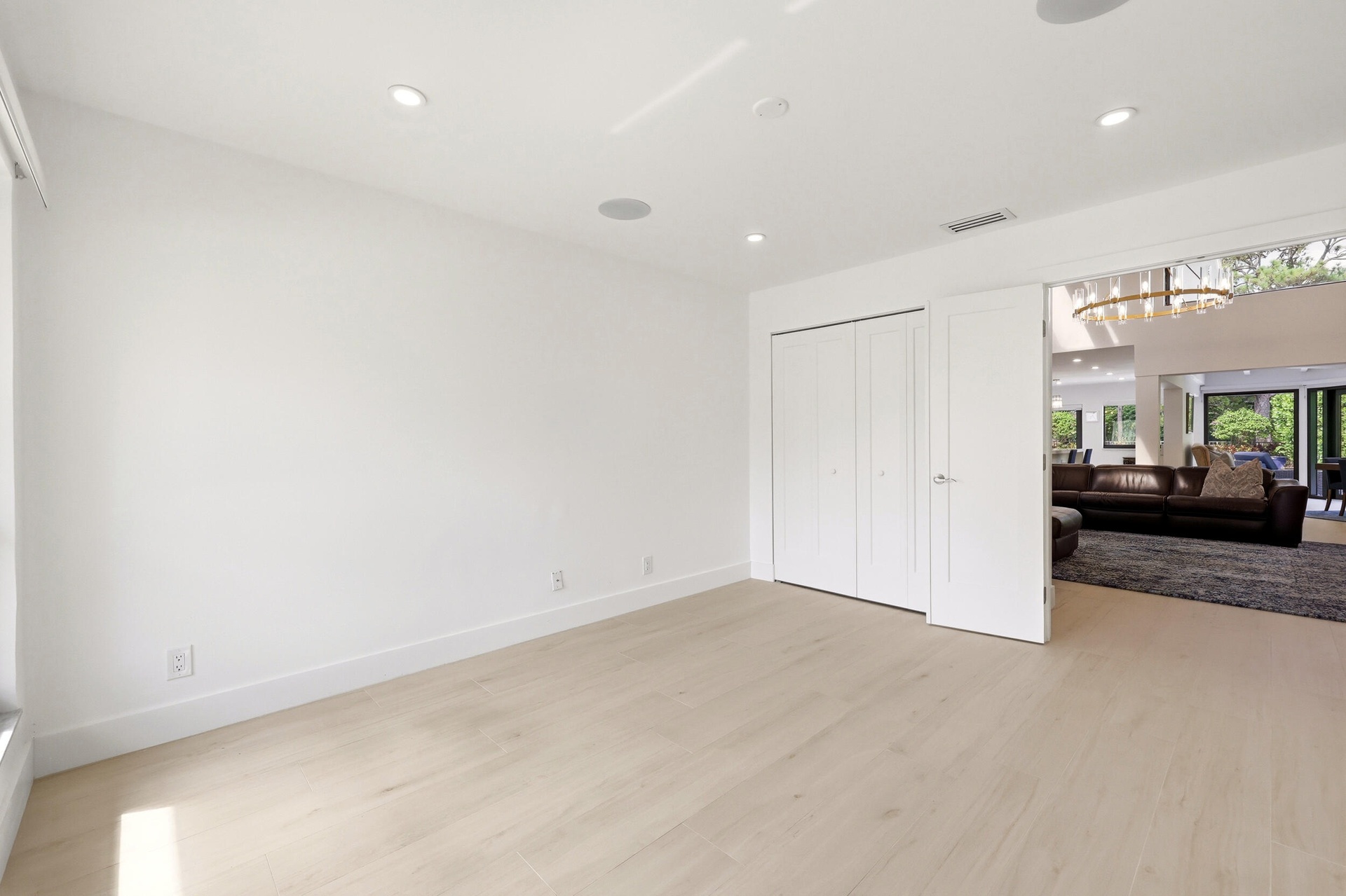 Bright, spacious, and versatile, this generously sized guest bedroom offers abundant natural light, ample closet space, and a clean contemporary desig