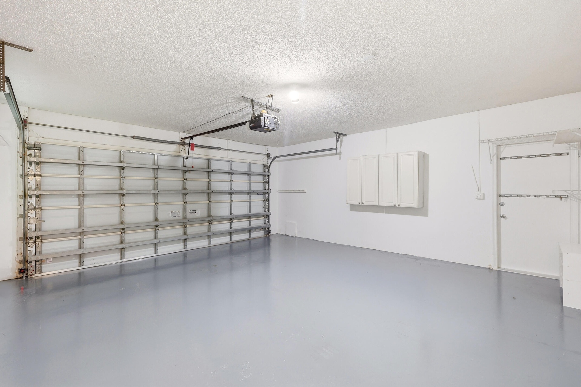 The oversized two-car garage offers an abundance of space for vehicles, storage, hobbies, and recreational equipment. Finished with an epoxy-coated fl