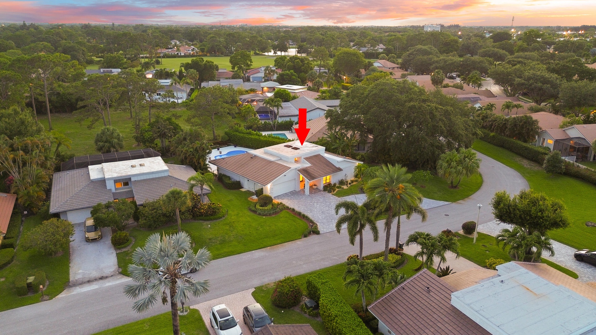 From above, the true rarity of this property comes into focus. Perfectly positioned on an oversized cul de sac lot, the home backs directly to a prote