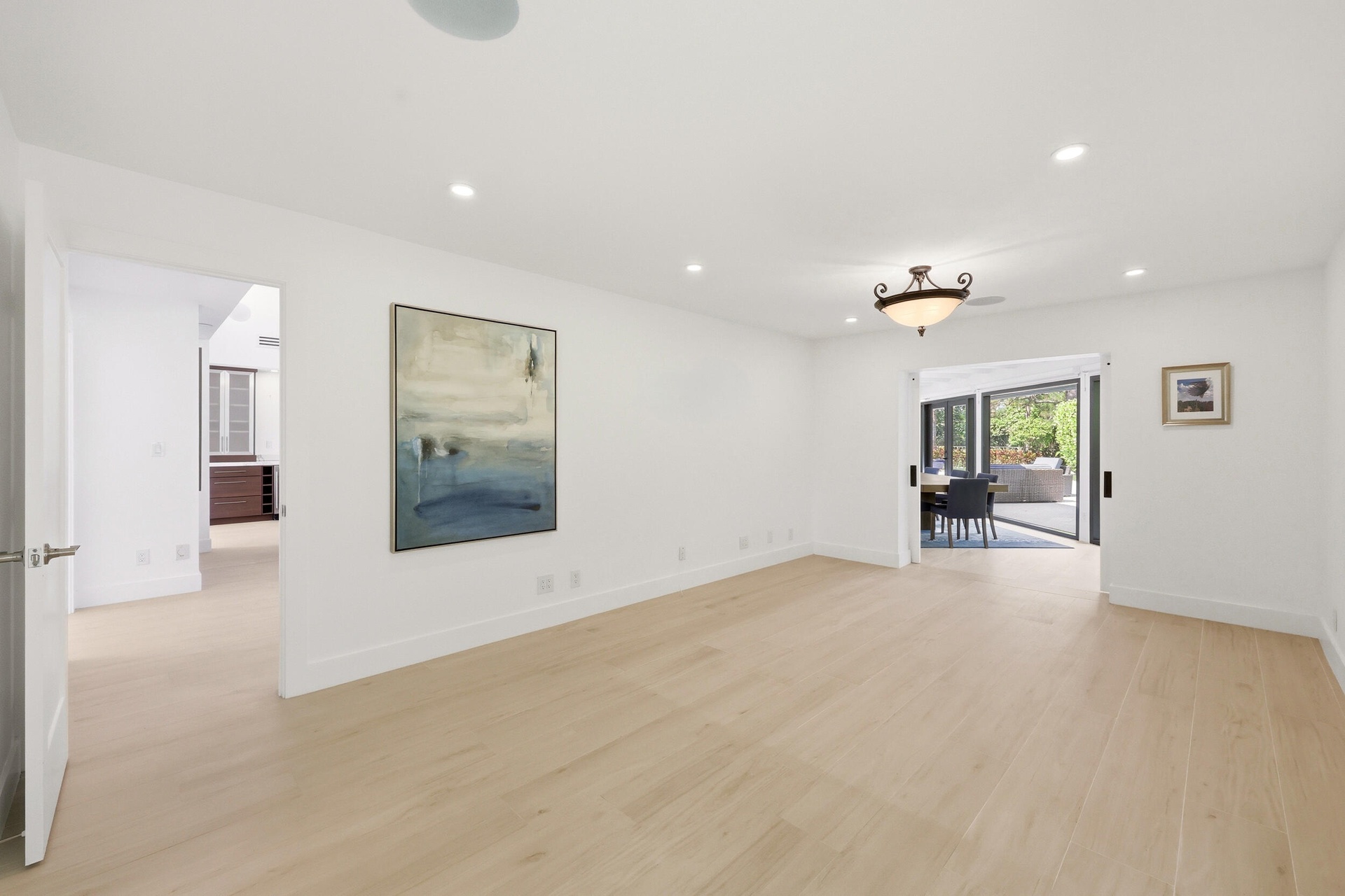 Privately tucked behind contemporary frosted glass barn doors, the primary suite is a tranquil retreat designed for comfort and relaxation. Filled wit
