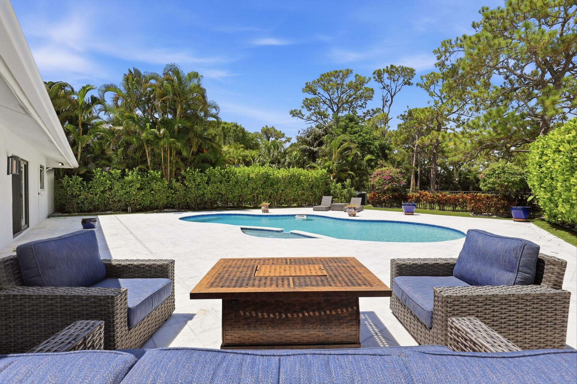 Discover your own private backyard sanctuary where modern luxury meets the natural beauty of Old Florida. Backing directly to a nature preserve, this 