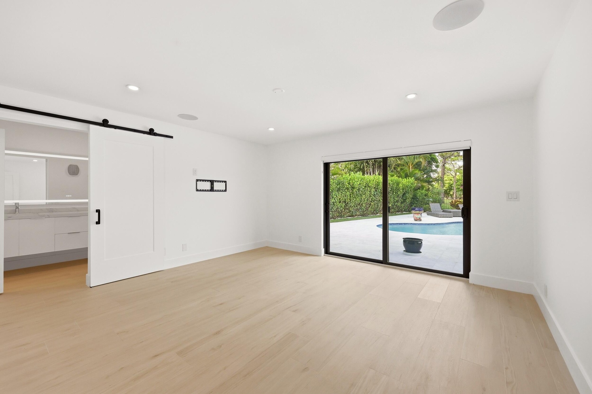 Designed as a true private guest retreat, this spacious suite offers exceptional comfort, privacy, and direct access to the backyard through oversized