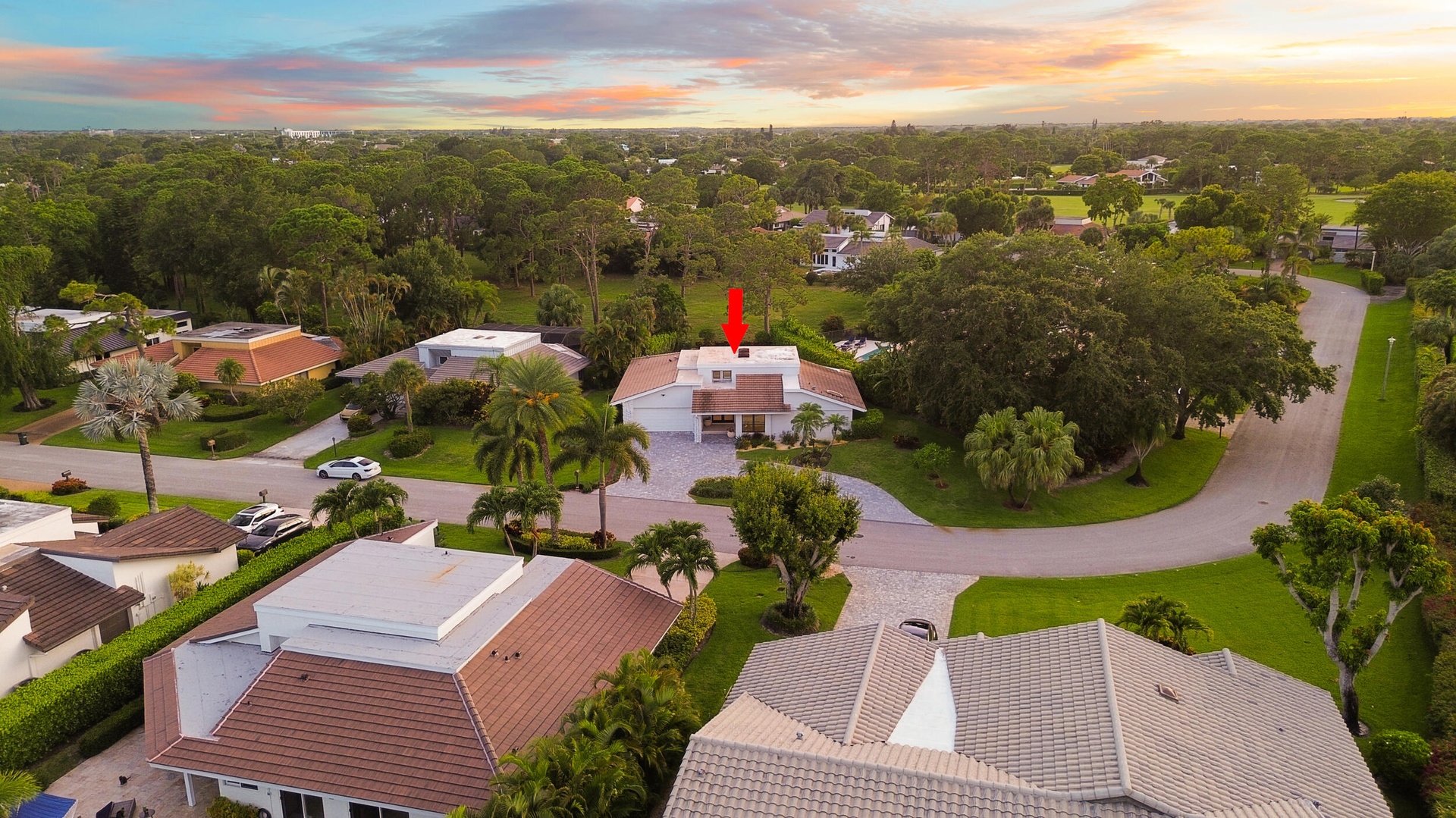 From above, the true rarity of this property comes into focus. Perfectly positioned on an oversized cul de sac lot, the home backs directly to a prote
