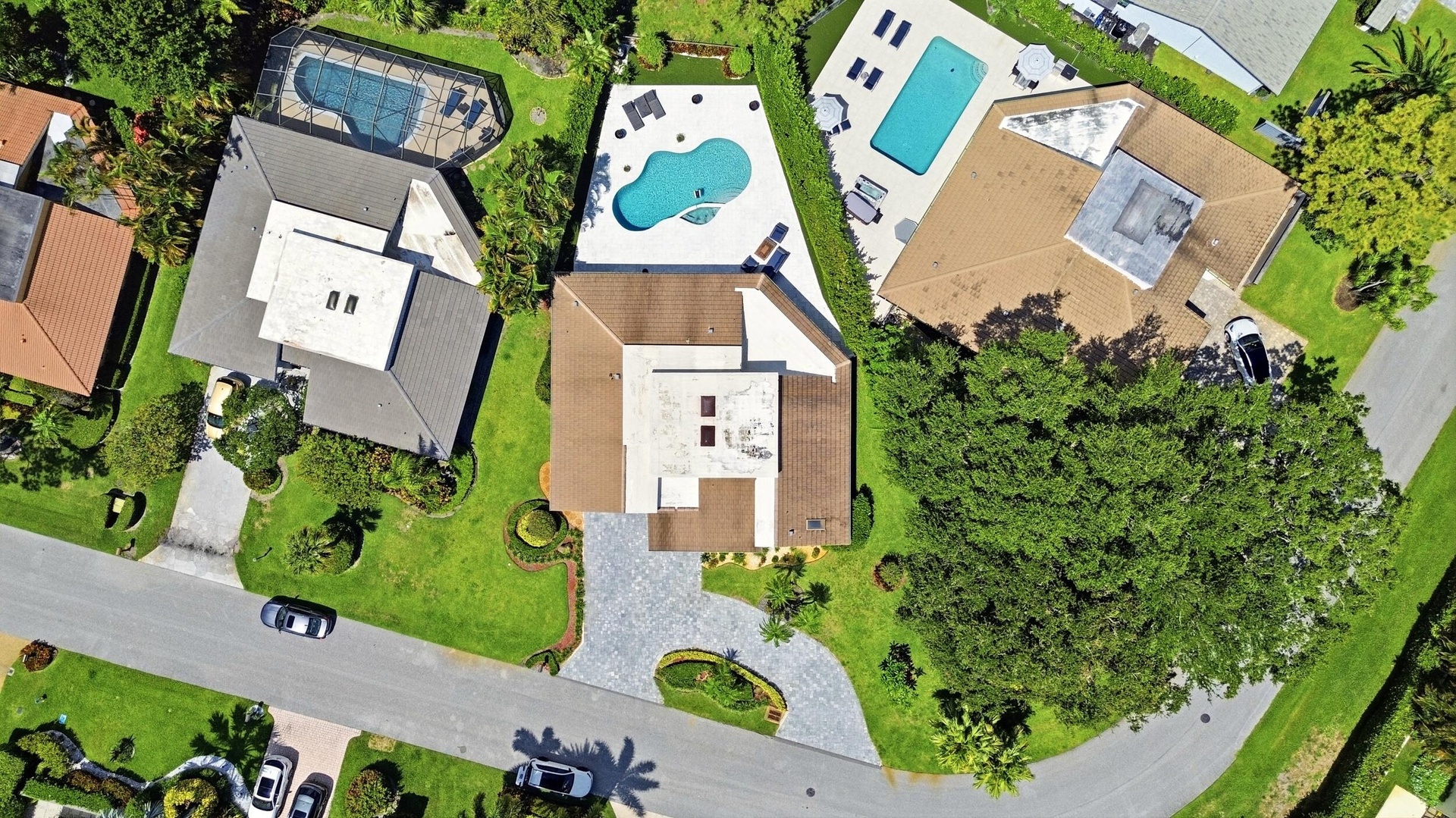 From above, the true rarity of this property comes into focus. Perfectly positioned on an oversized cul de sac lot, the home backs directly to a prote