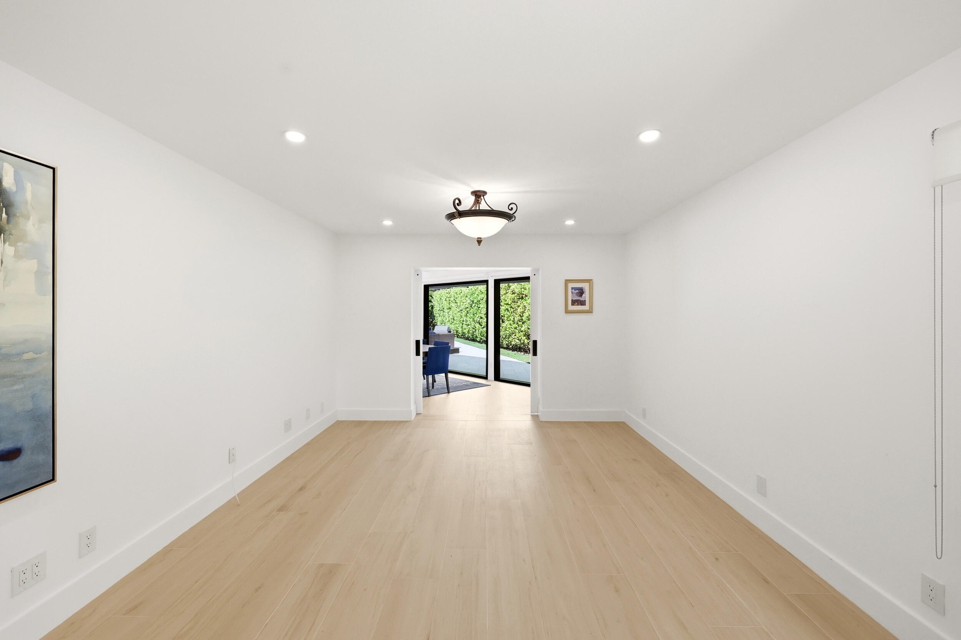 Privately tucked behind contemporary frosted glass barn doors, the primary suite is a tranquil retreat designed for comfort and relaxation. Filled wit