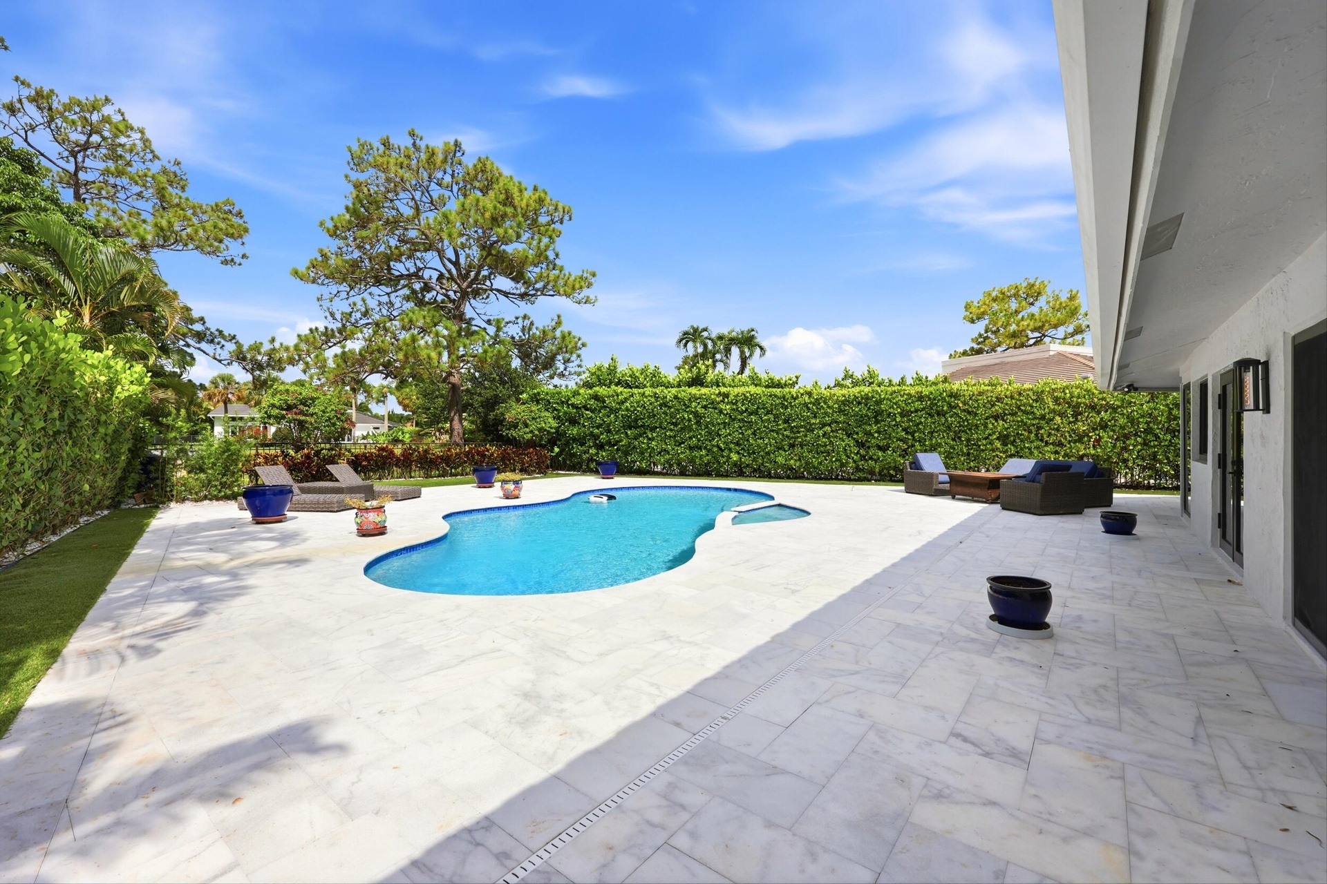 Discover your own private backyard sanctuary where modern luxury meets the natural beauty of Old Florida. Backing directly to a nature preserve, this 