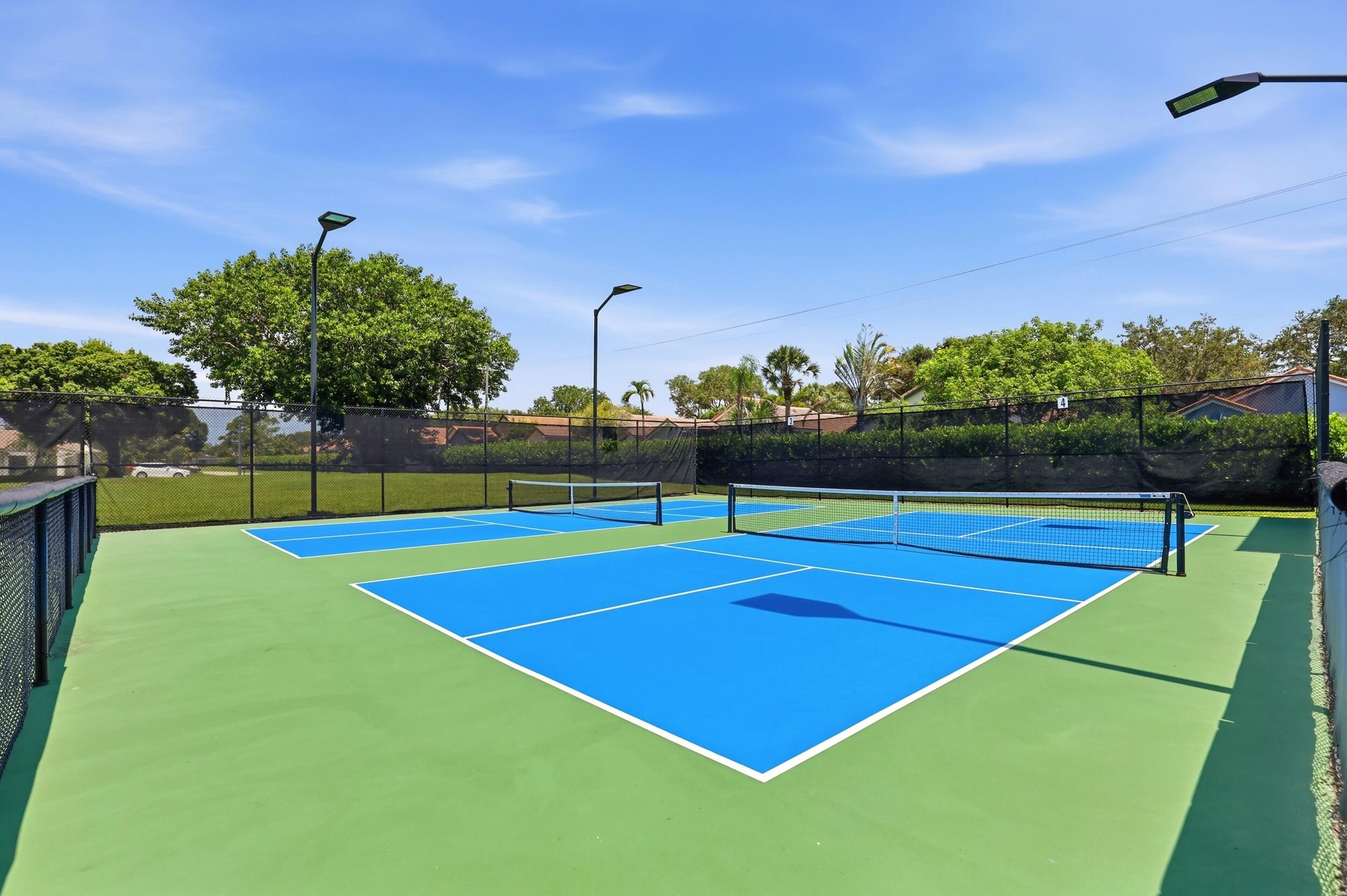 Enjoy one of the community's most popular amenities with beautifully maintained pickleball courts featuring covered seating, providing the perfect pla