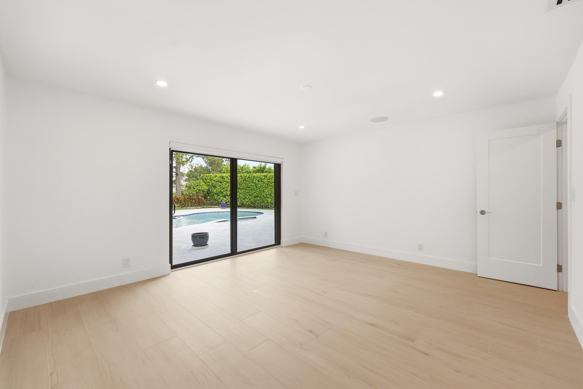 Designed as a true private guest retreat, this spacious suite offers exceptional comfort, privacy, and direct access to the backyard through oversized
