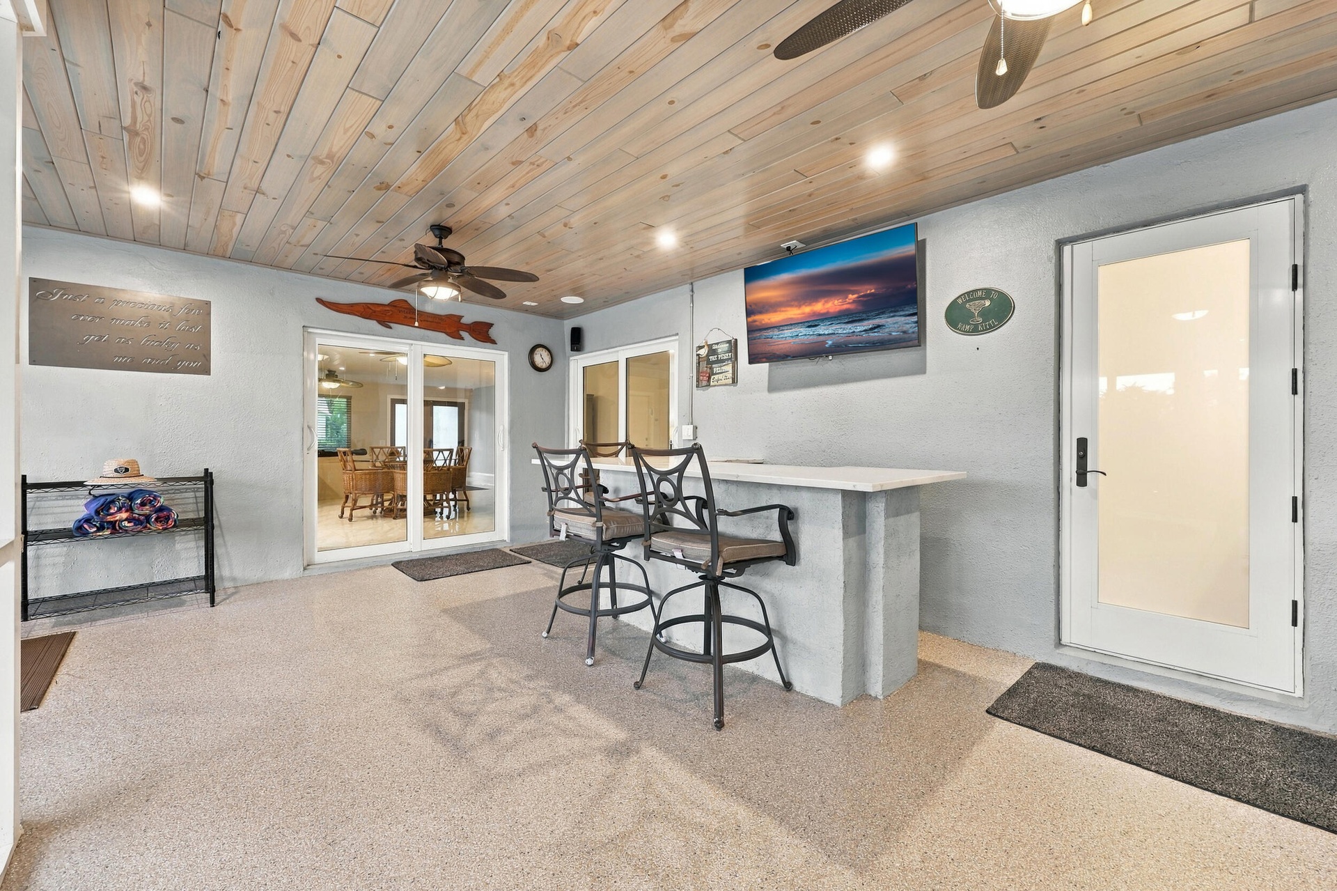 Live the epitome of the South Florida lifestyle with this 1,360 sq. ft. patio. It offers a built-in bar with quartz countertops, a grill area with hoo