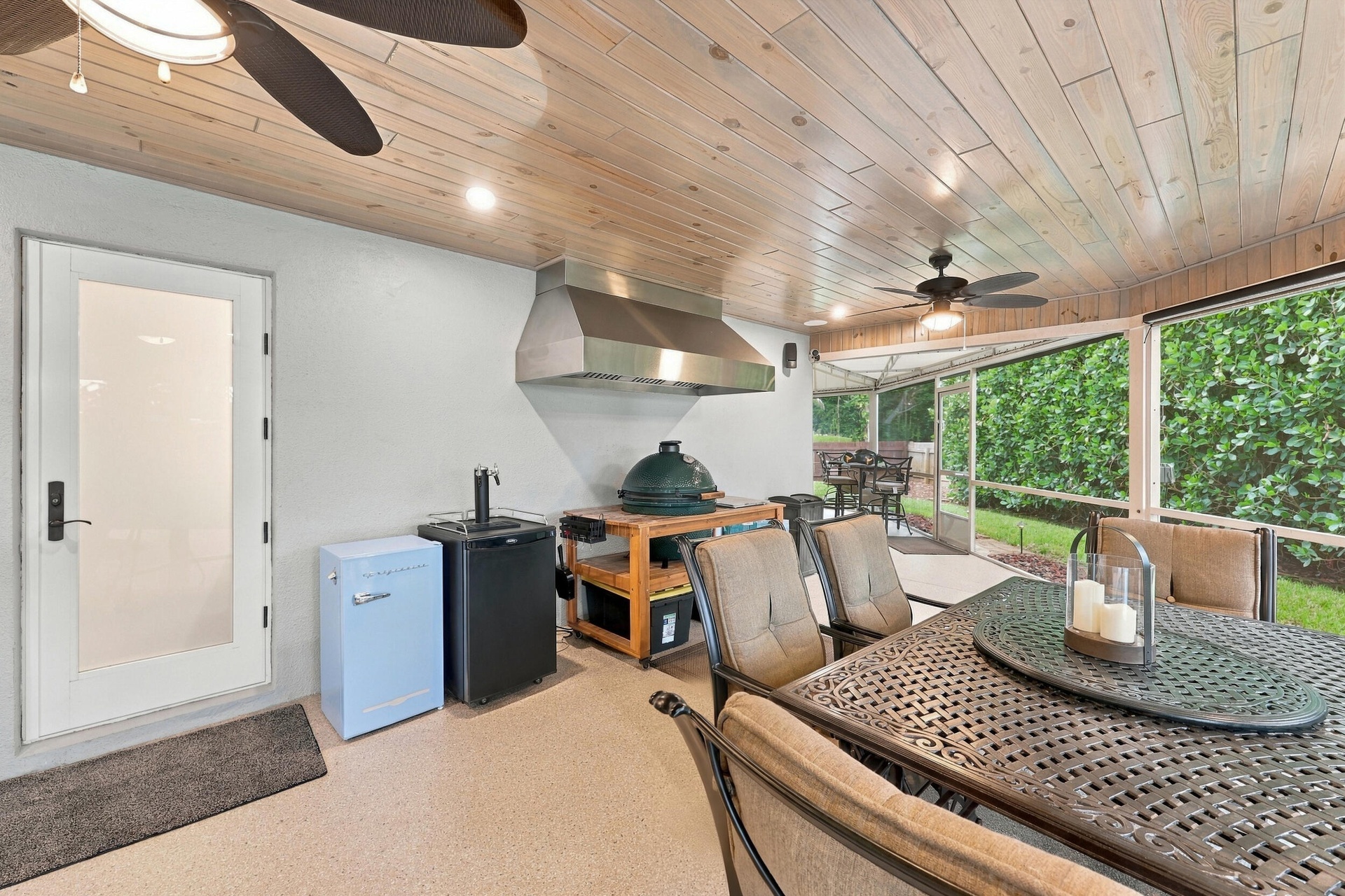 Live the epitome of the South Florida lifestyle with this 1,360 sq. ft. patio. It offers a built-in bar with quartz countertops, a grill area with hoo