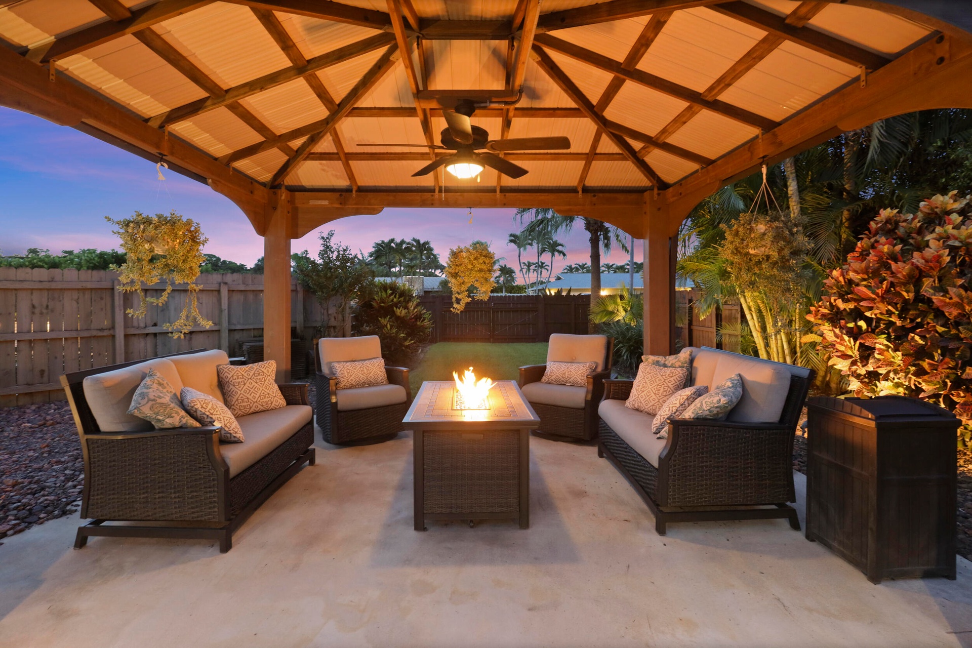 A built-in gazebo with electric offers a private, cozy space to relax and unwind. Beyond the pool is a space big enough to fit an RV, boat, golf simul