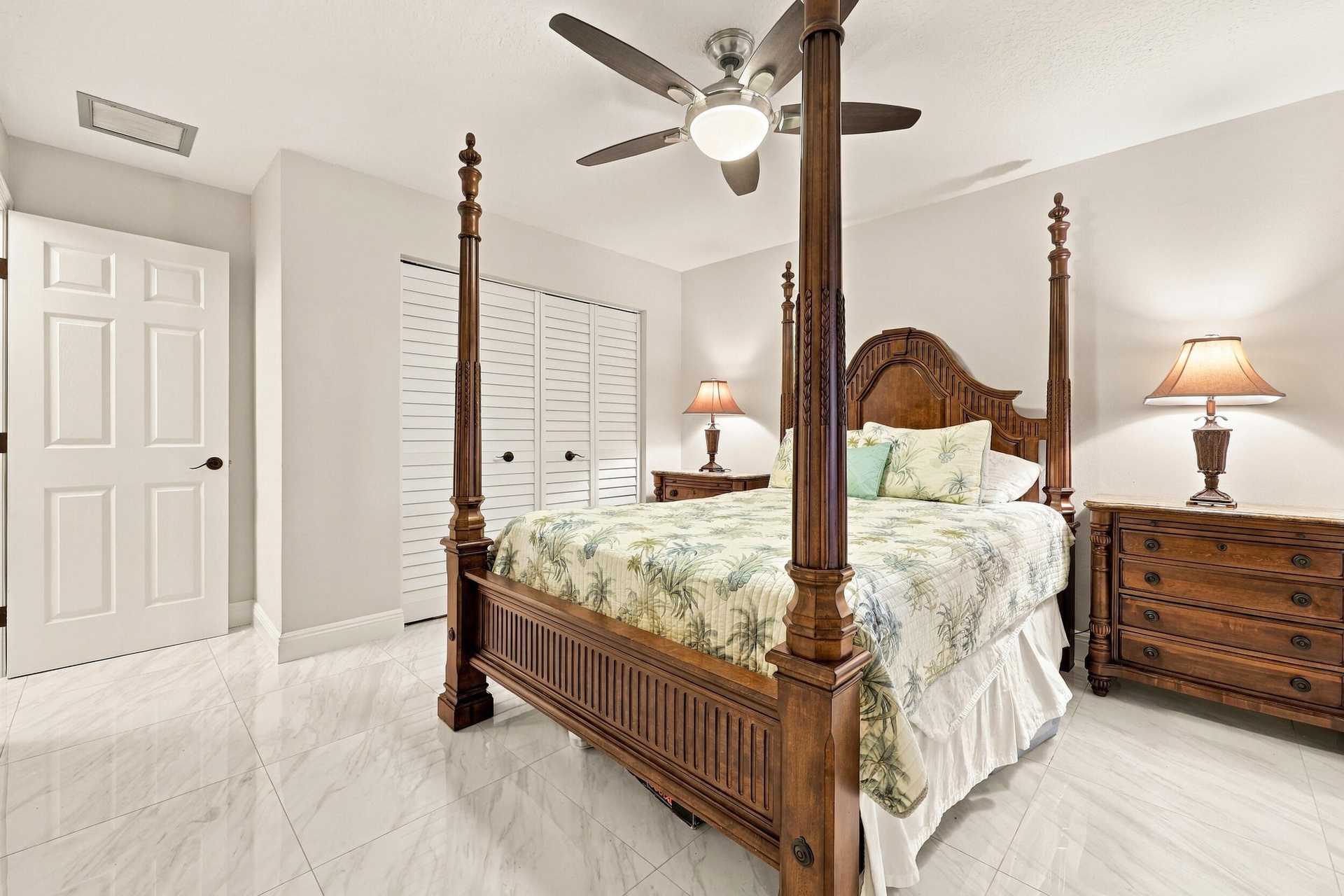 Guest bedroom 3 offers lots of natural light through a hurricane impact glass window and lots of closet space.
