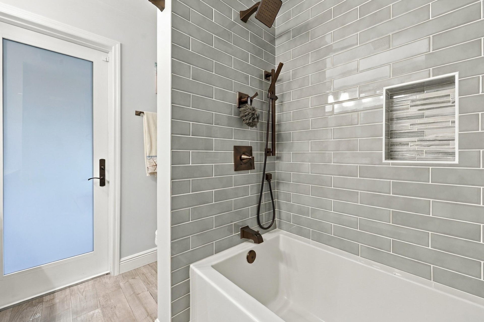 Bathroom 3 is a fully updated cabana bathroom with a new vanity, countertops, tile, and a tub and shower. Your guests will access it while spending da