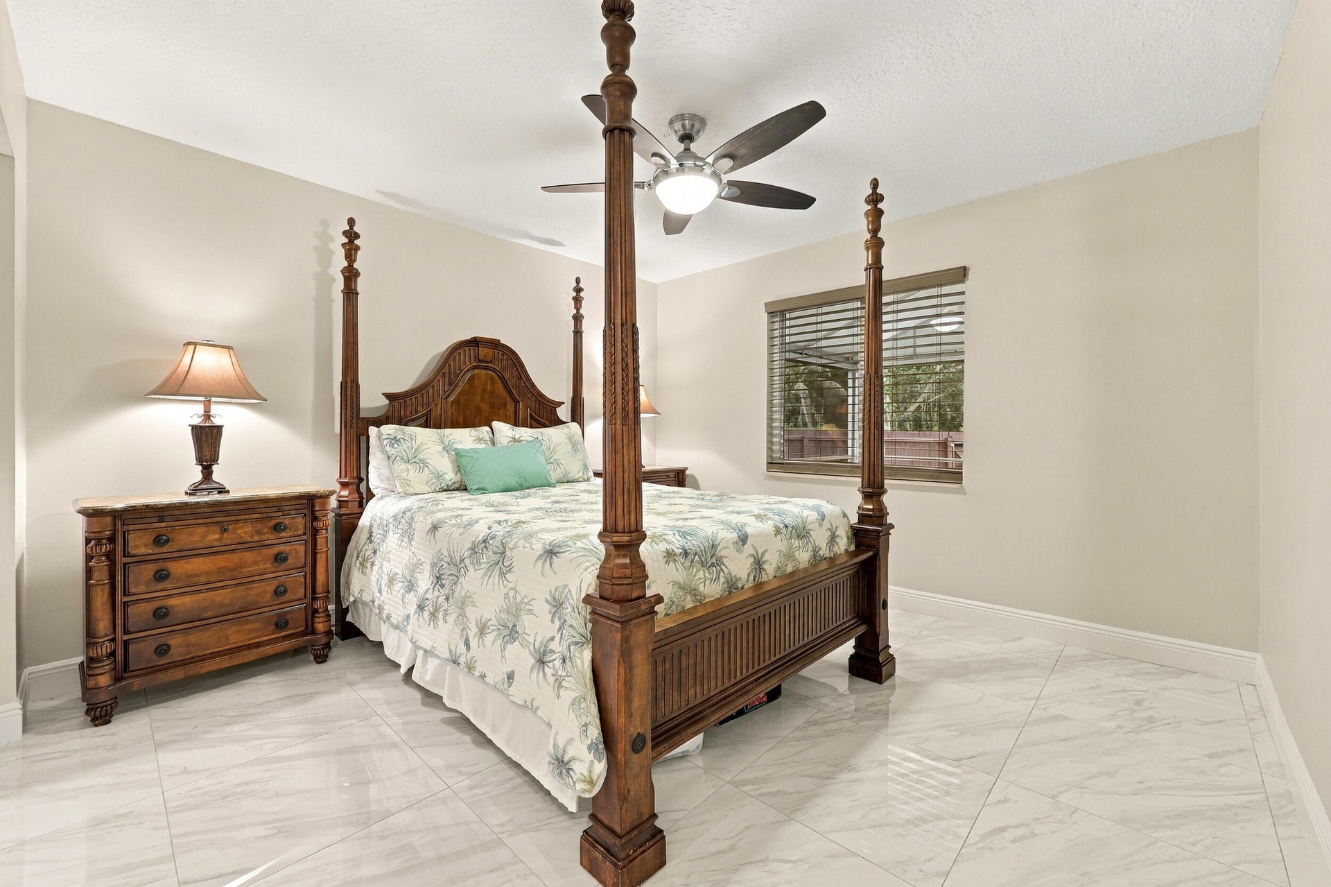 Guest bedroom 3 offers lots of natural light through a hurricane impact glass window and lots of closet space.