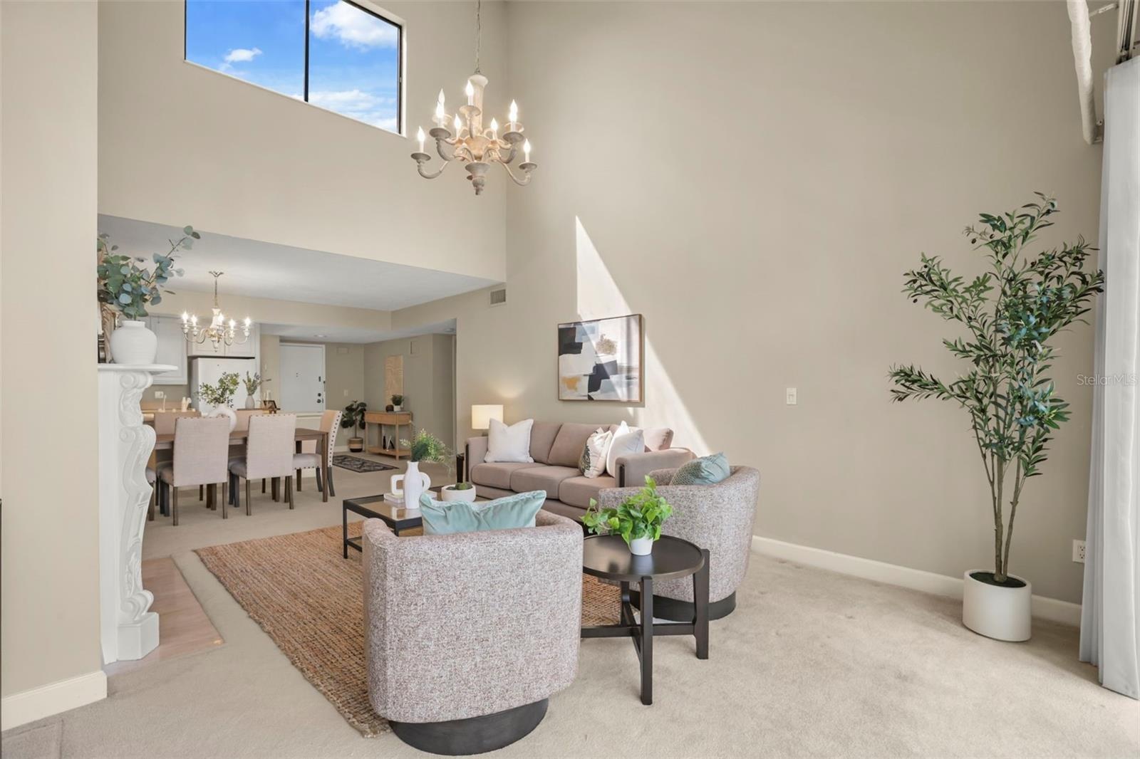 The top-floor location means natural light fills the large living room with additional windows along the vaulted ceiling!