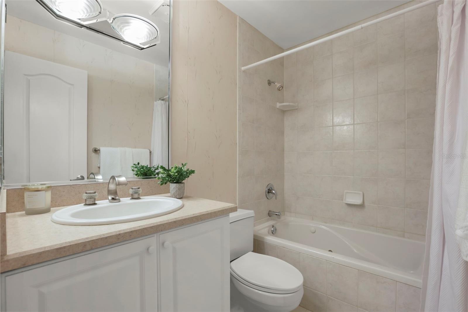 The guest bathroom includes a jetted tub.