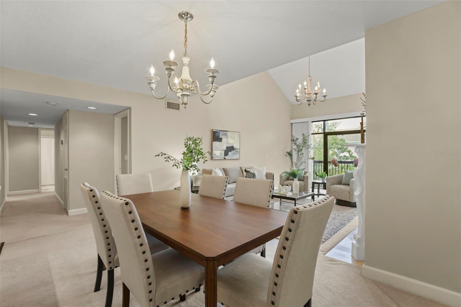 Perfect for both quiet dinners at home or large parties, the dining room seamlessly leads to the living room.