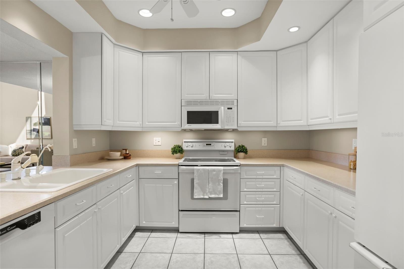 Both cabinet storage and counter space are abundant in this bright kitchen!