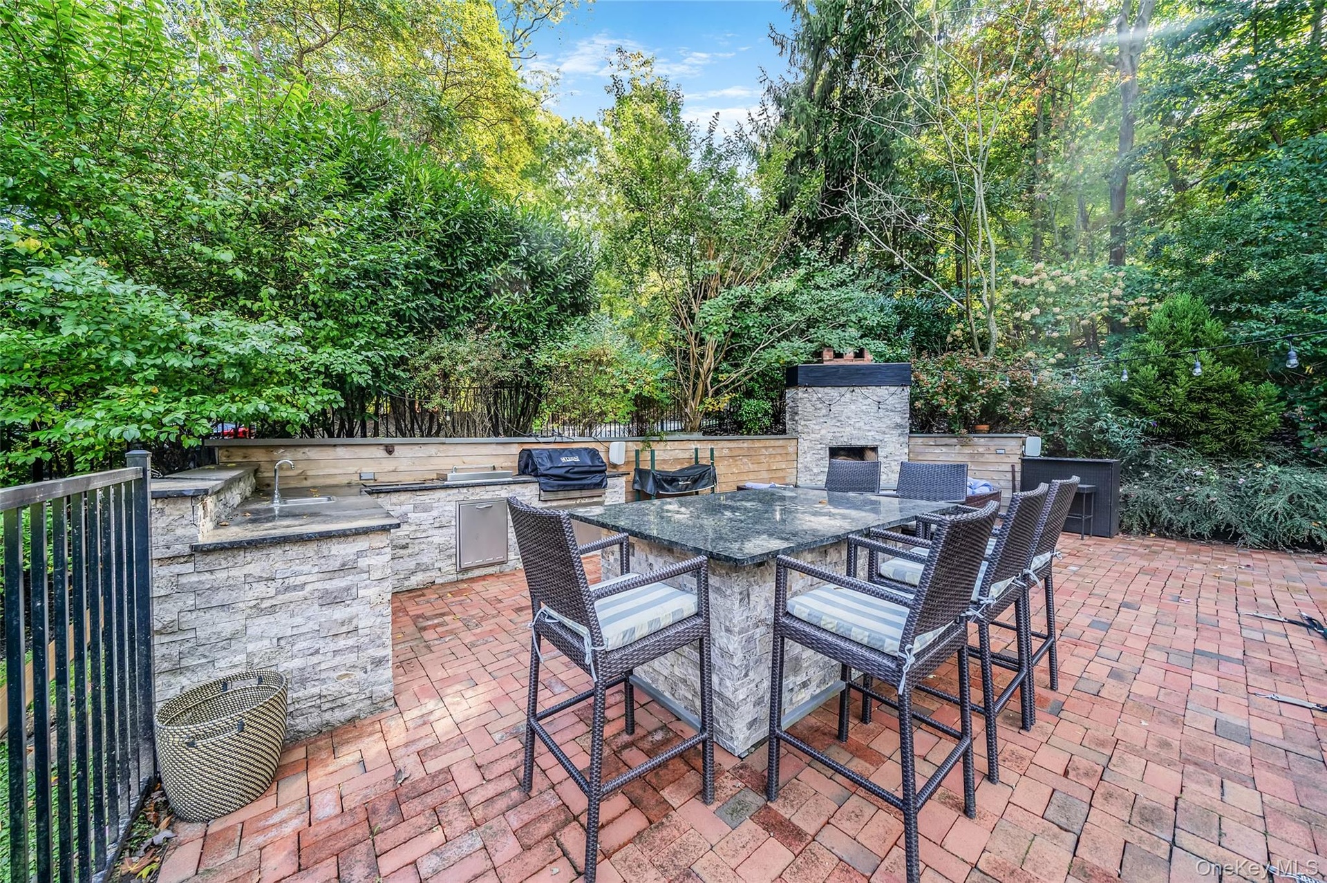 Fenced IG Pool, with brick surround and outdoor kitchen