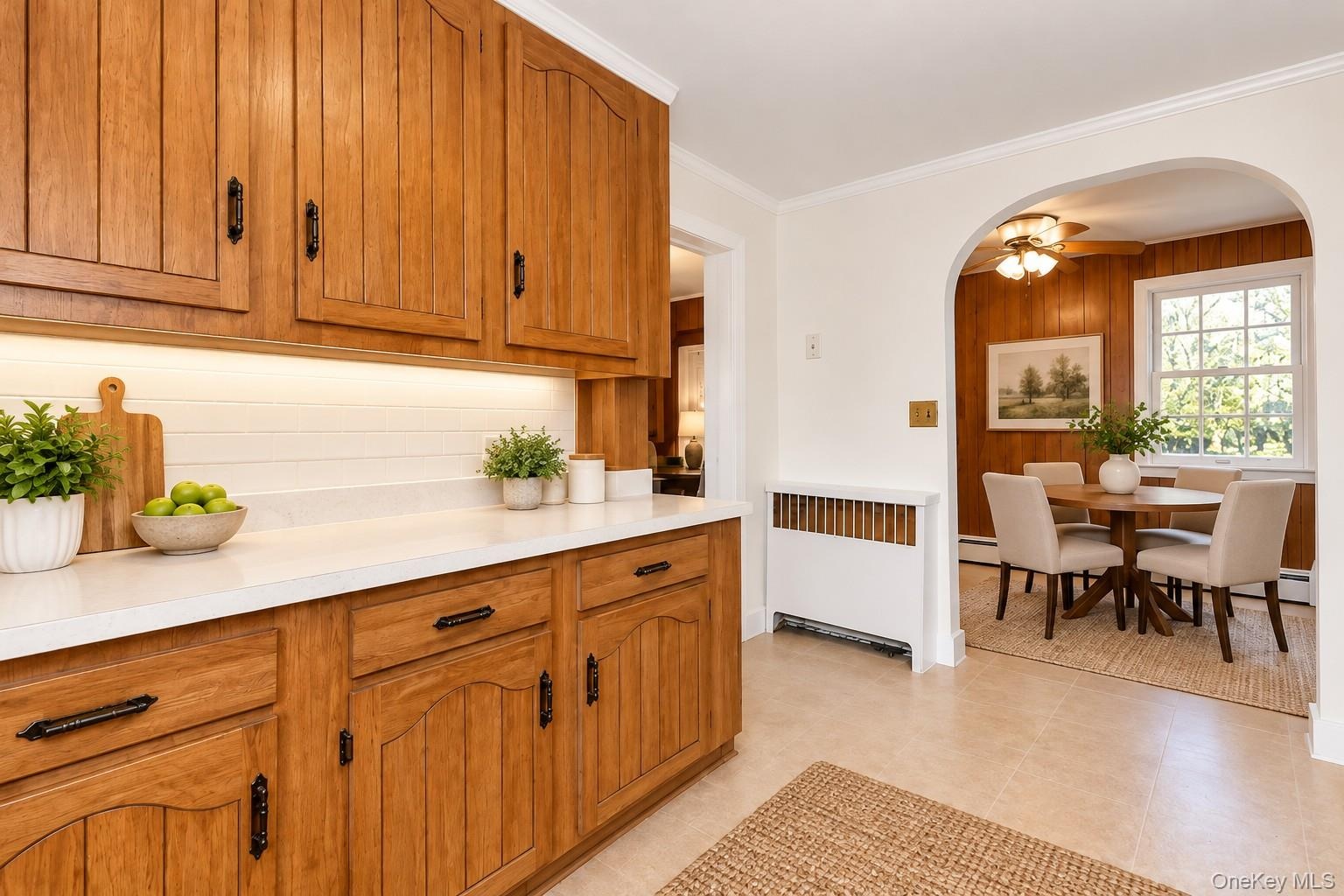 Virtually Staged Eat-In Kitchen and Dining AreaThis charming eat-in kitchen has been thoughtfully virtually staged to highlight its warmth, functional