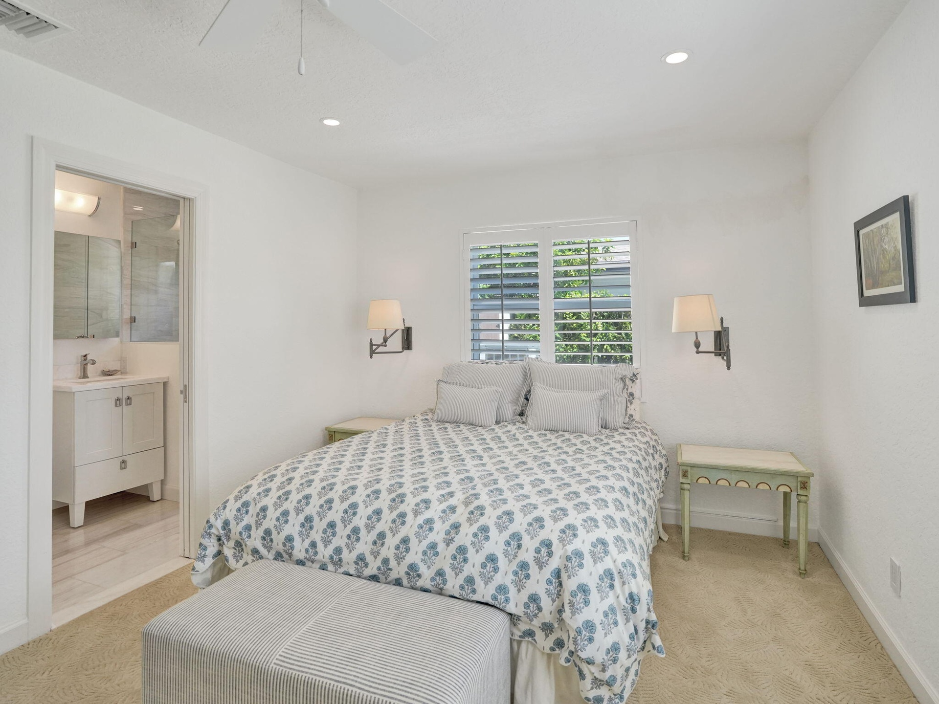 Spacious Bedroom with recessed lighting.