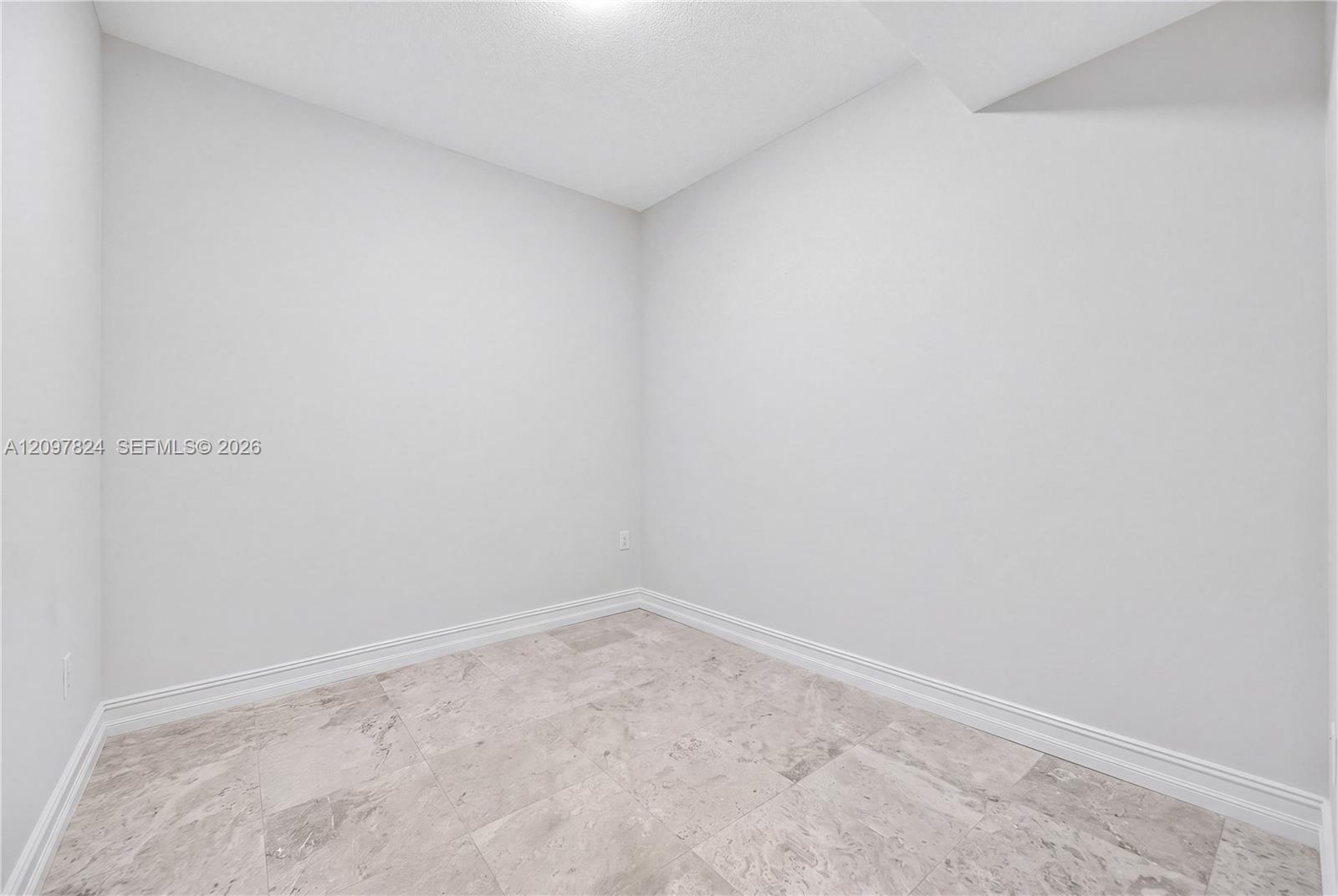 Den currently used as office and storage, easily a 3rd bedroom