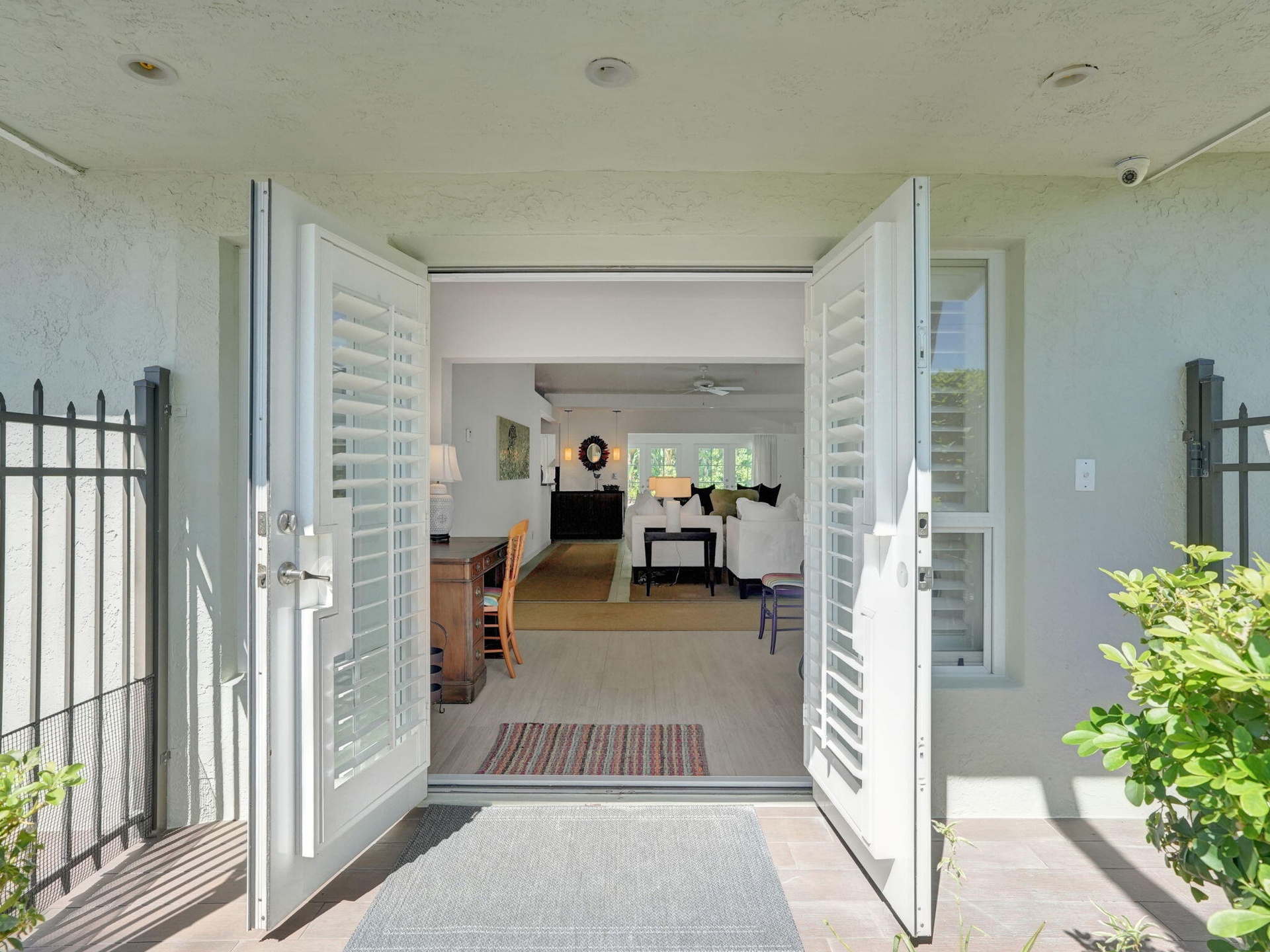 Double French doors with louvered panels.