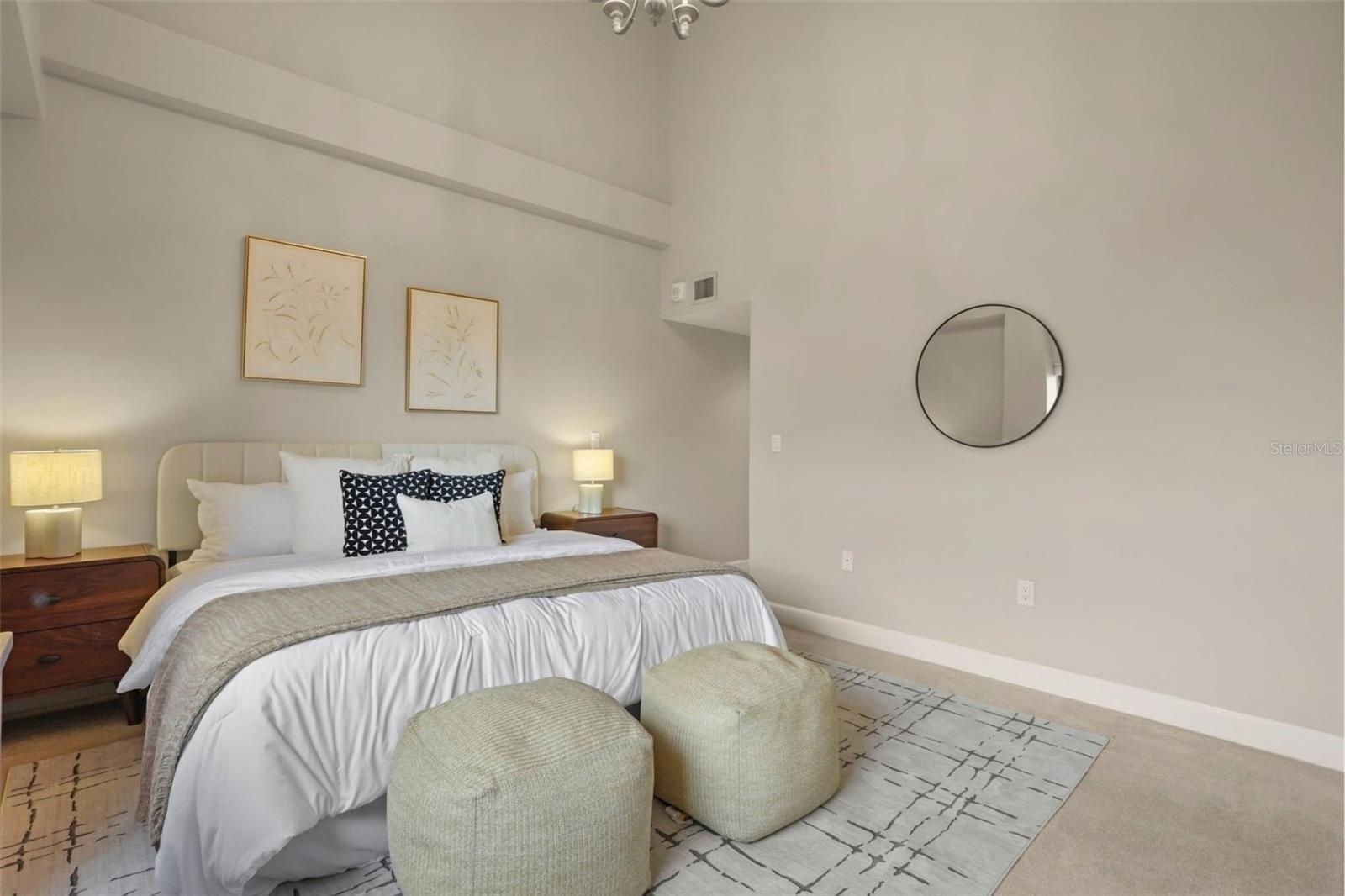 Vaulted ceilings continue to the primary suite in an expansive layout.