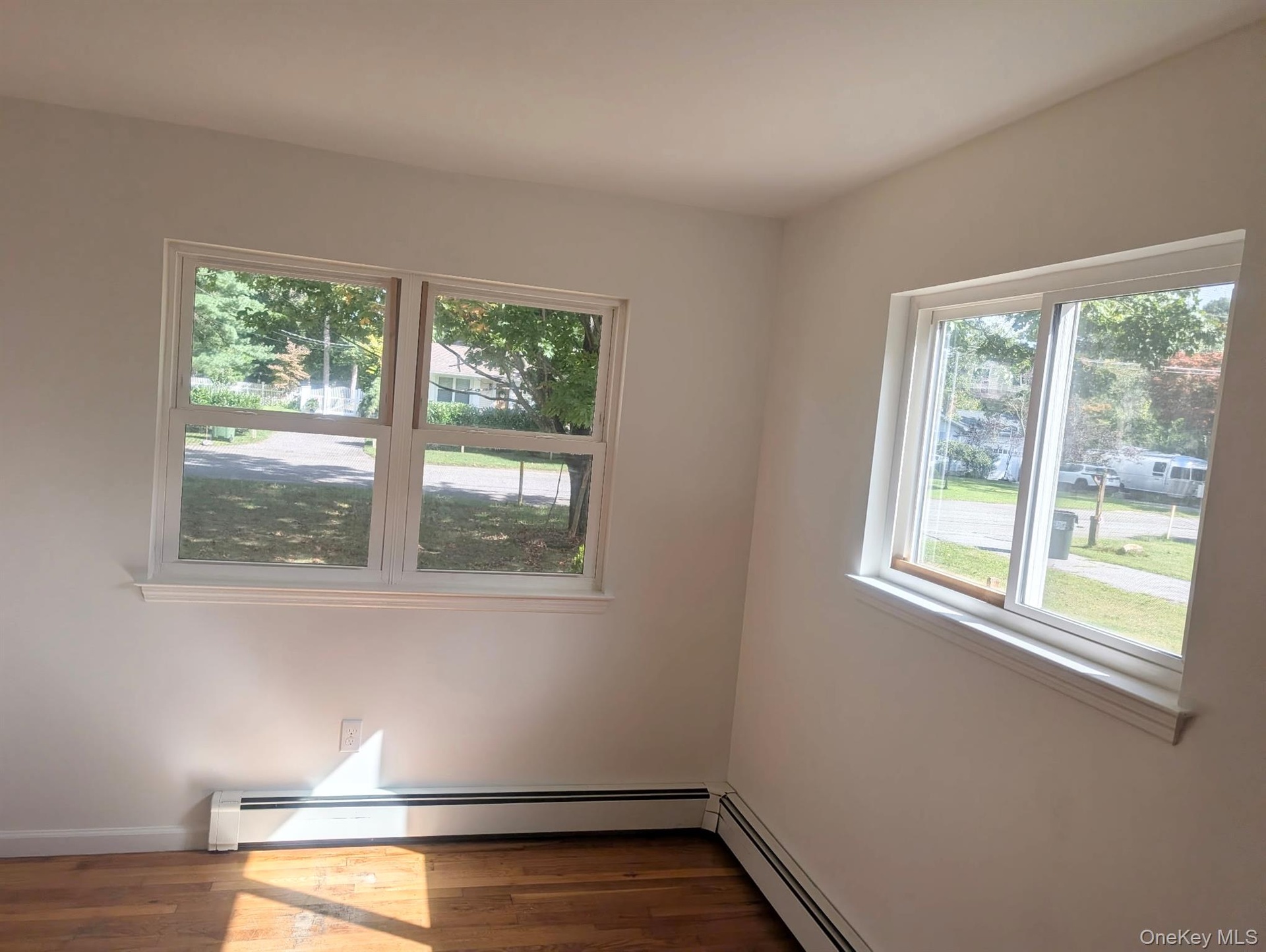 ...hardwood flooring and baseboard heating...