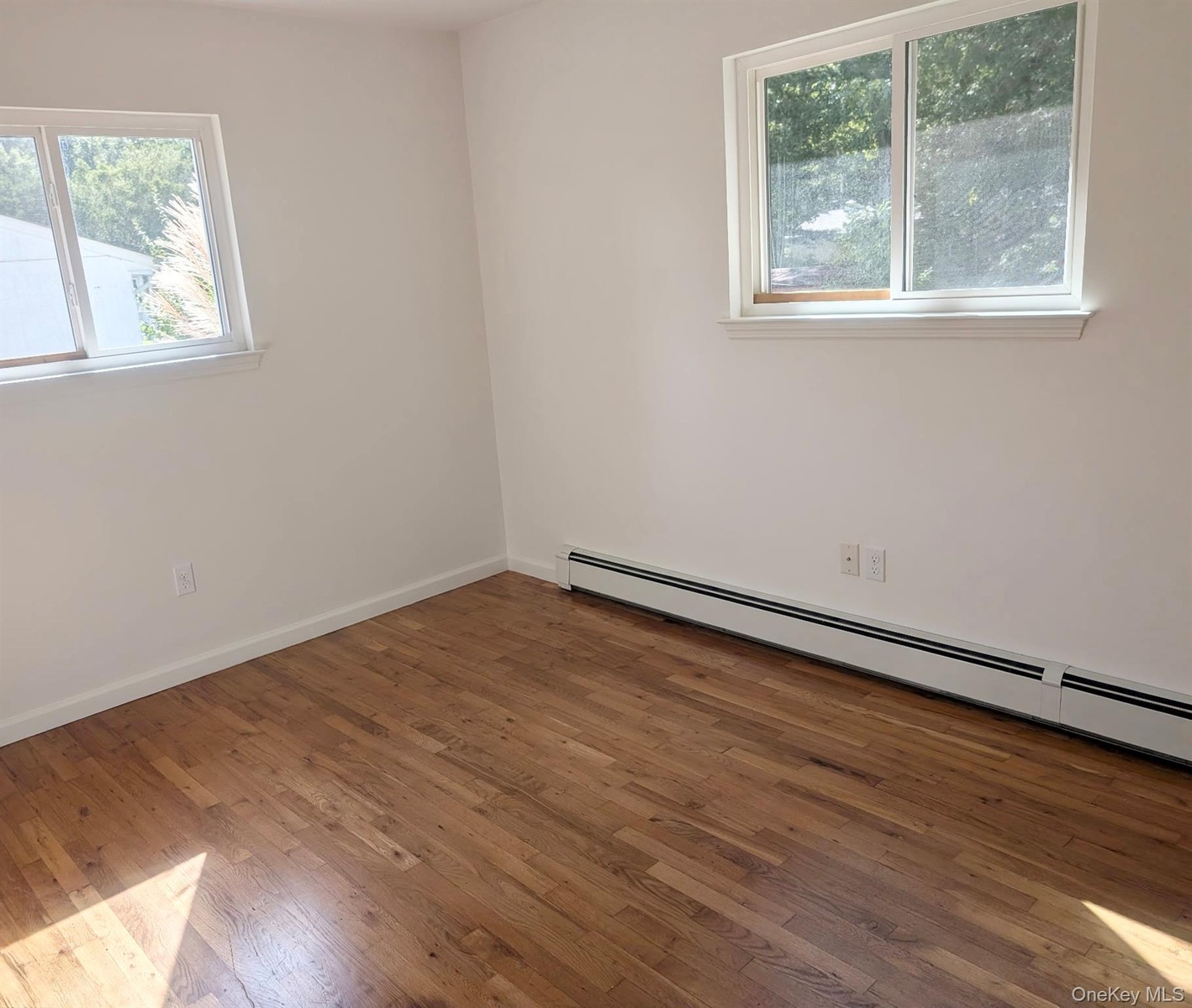 All rooms boast fresh paint, newer windows with white trim...