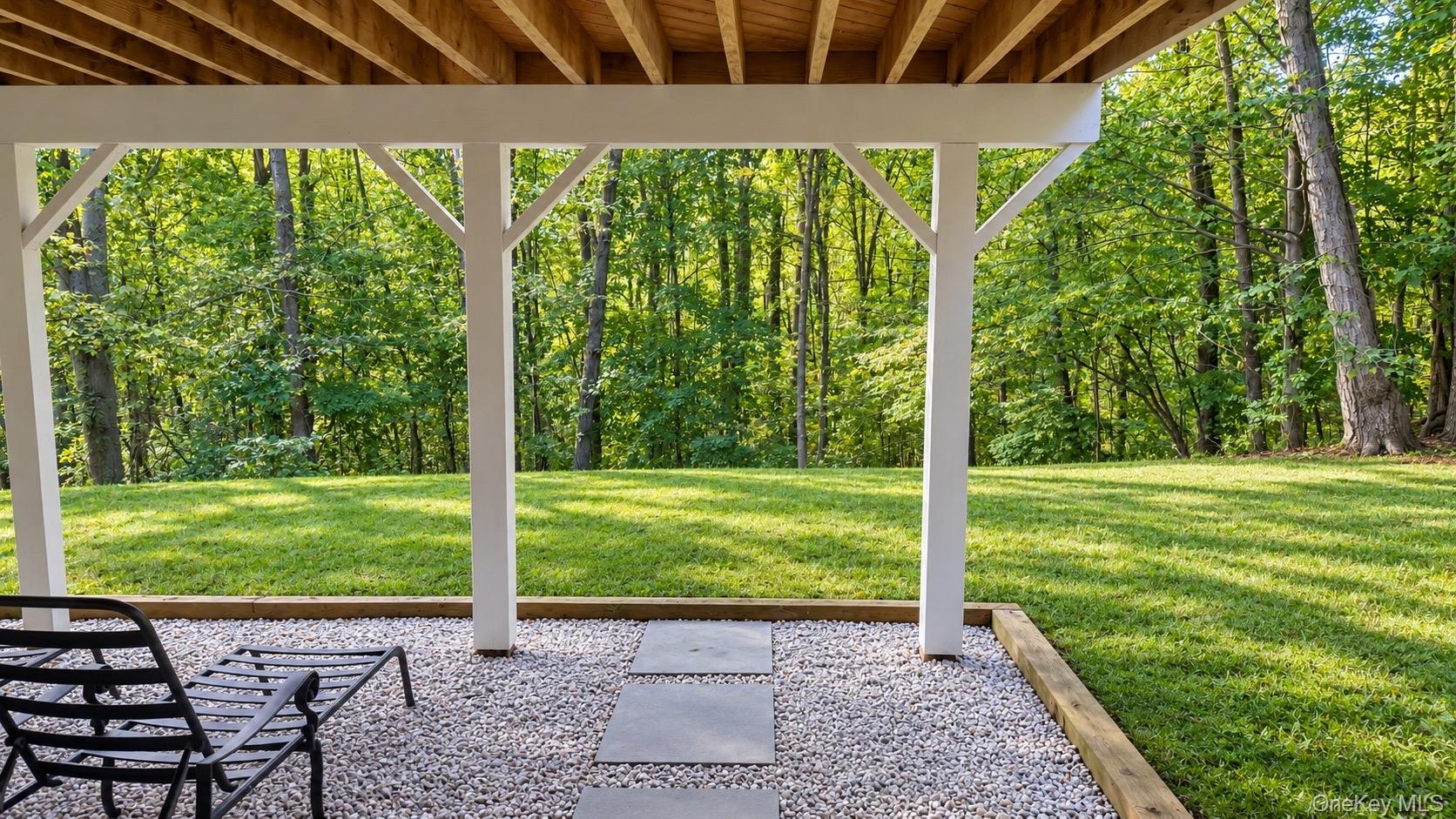 Private, Nearly Level Backyard Framed by Mature Landscaping—With Endless Possibilities! (Digitally Enhanced Photo)