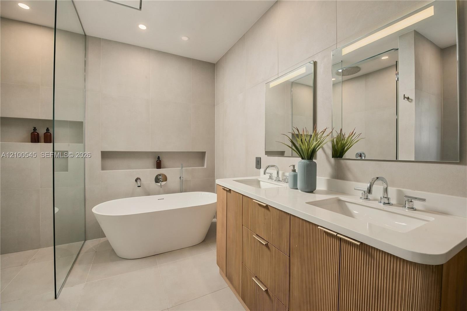 Primary Bath with double sinks, shower and bathtub.