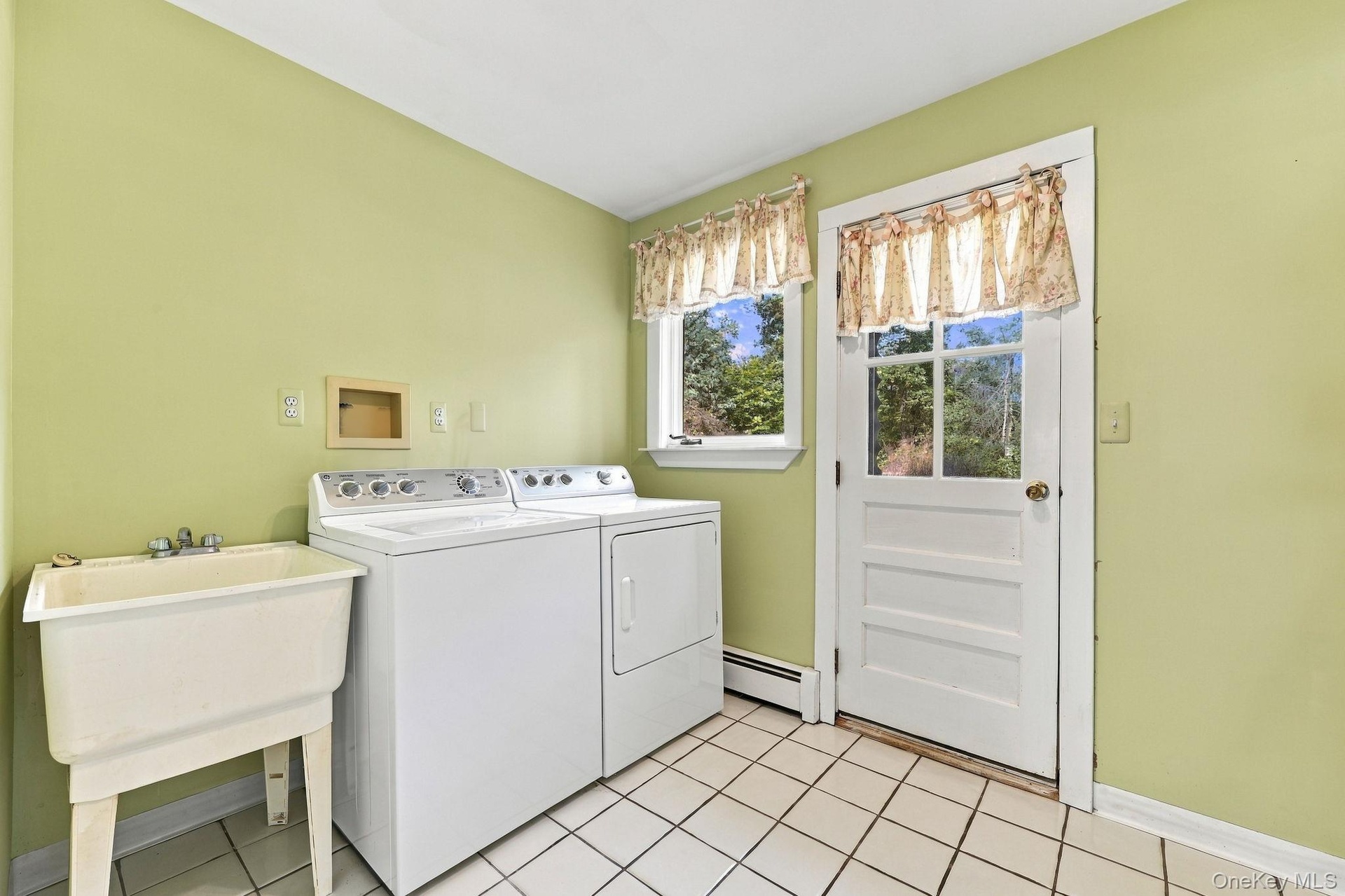 Laundry room leads out to backyard