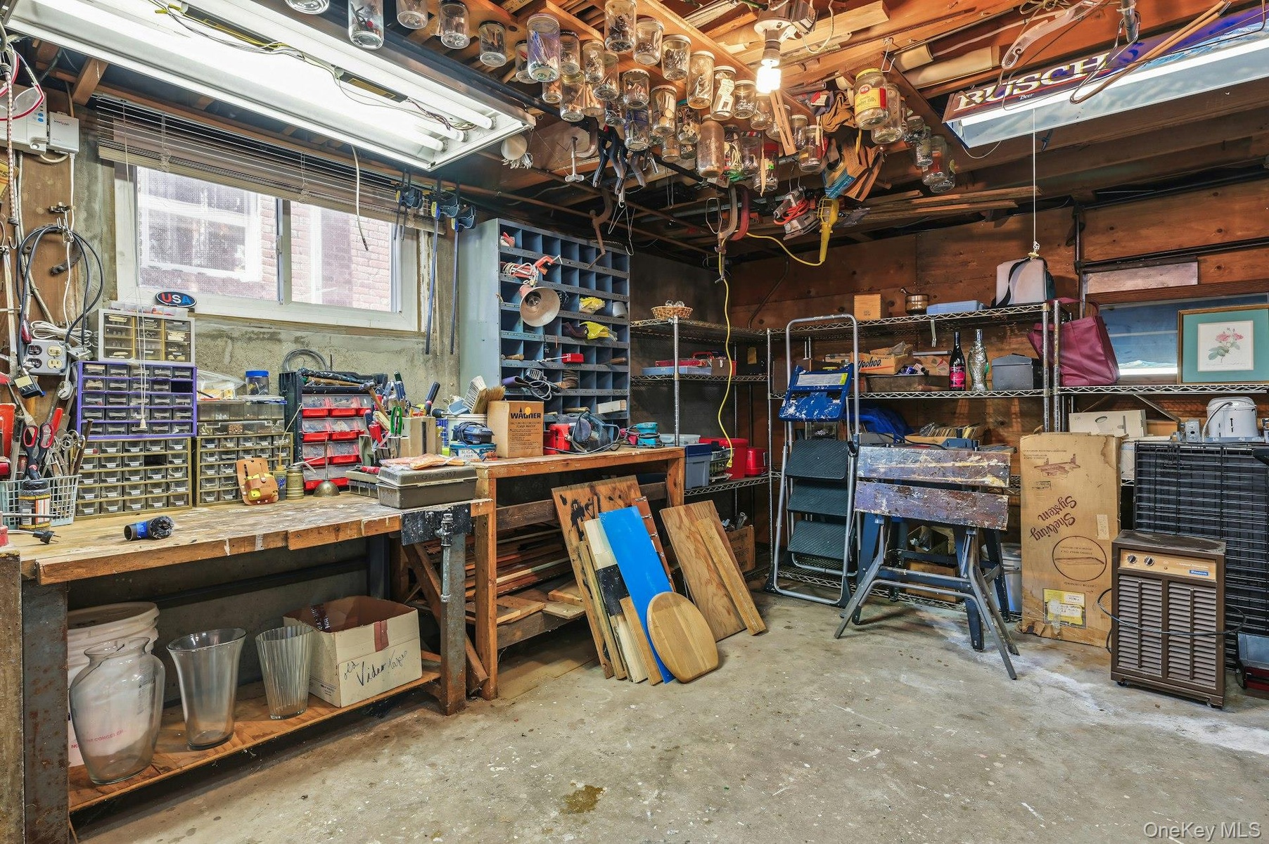 Storage/laundry room in unfinished portion of basement.