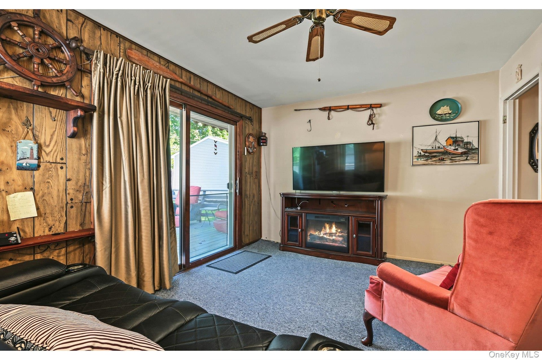 Third bedroom or versatile bonus room with direct access to the outdoor deck.
