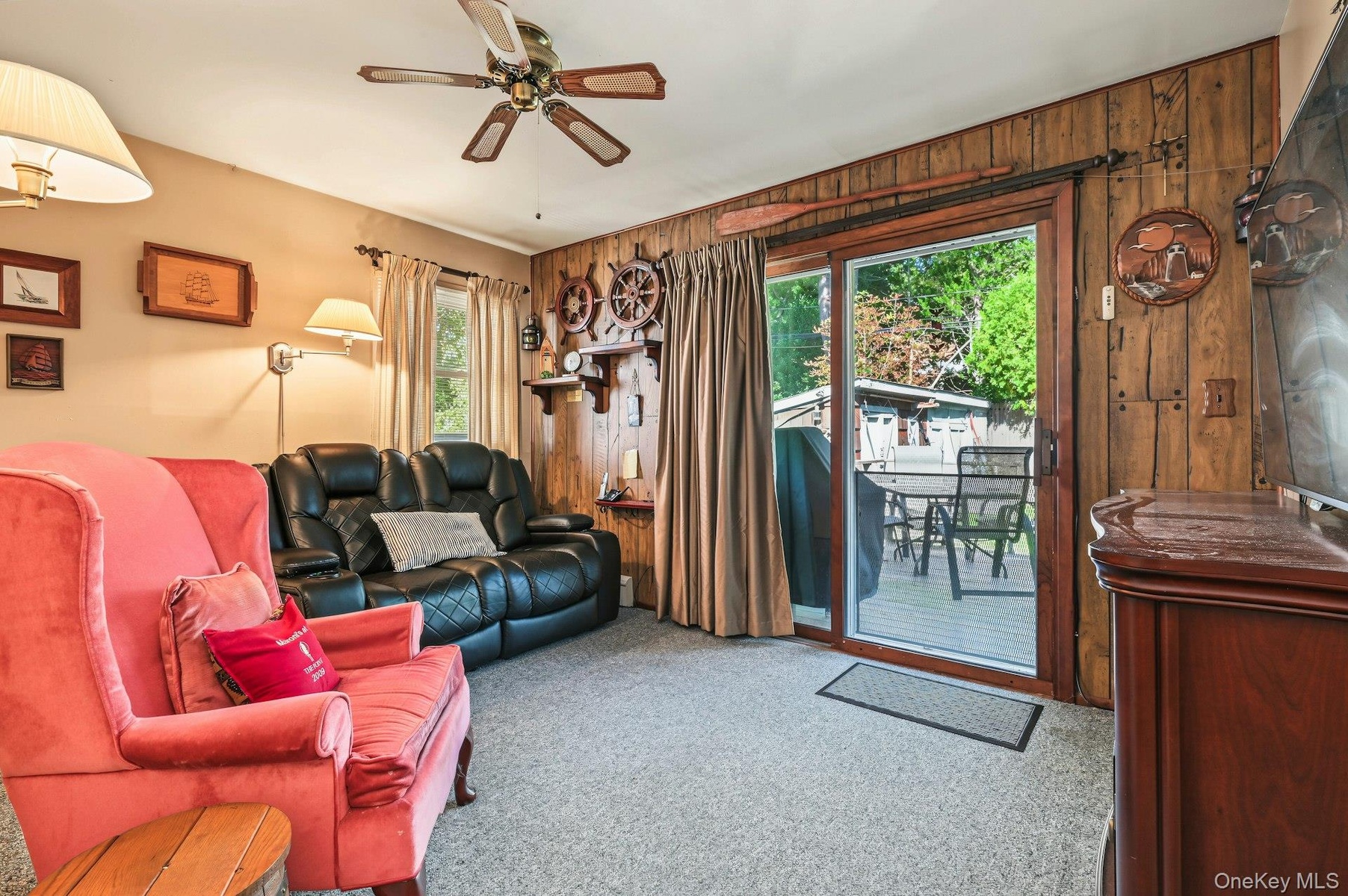 Third bedroom or versatile bonus room with direct access to the outdoor deck.