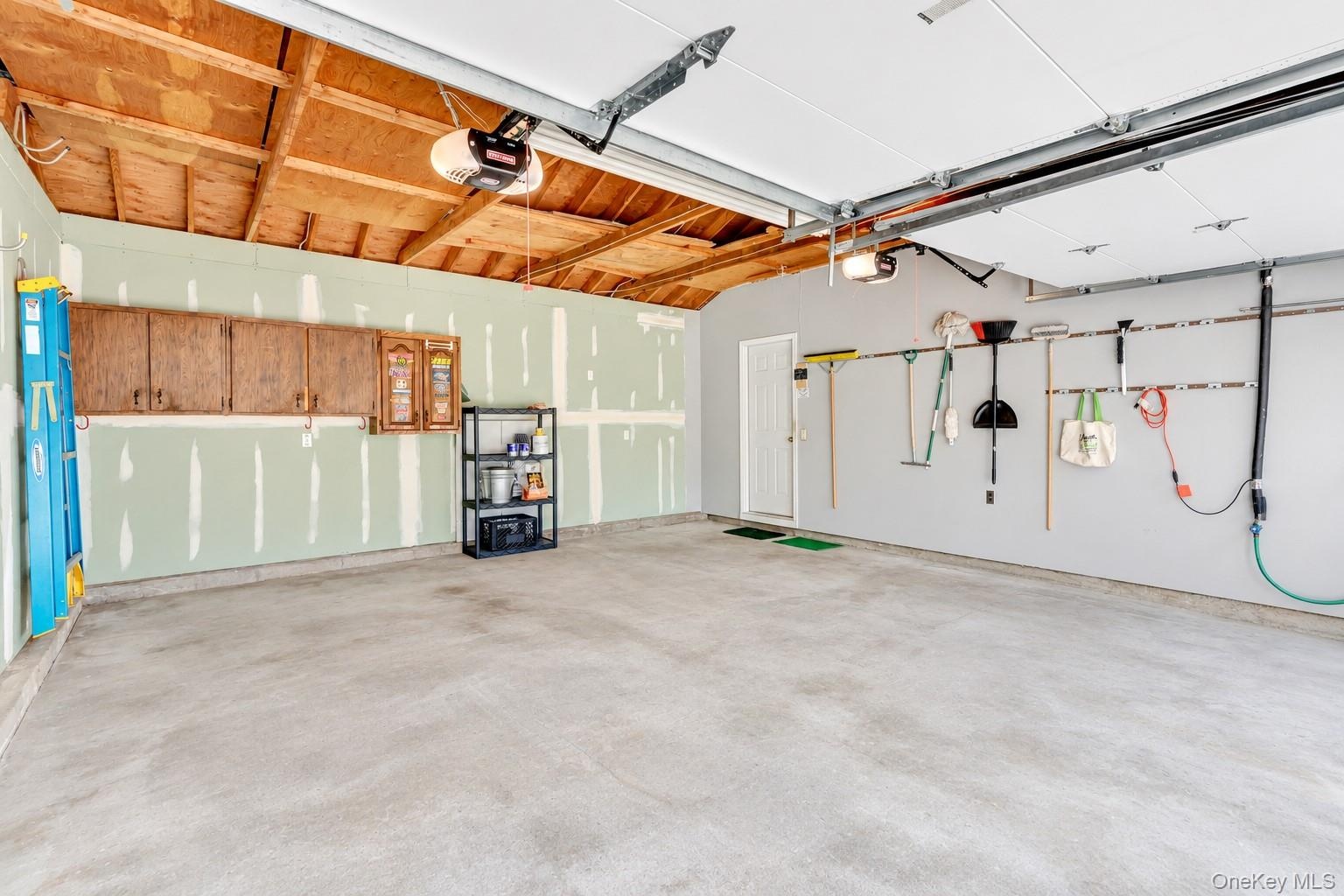 Original Front Entry 2 Car Garage With Storage Above