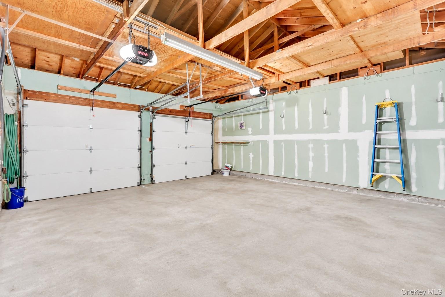 Original Front Entry 2 Car Garage With Storage Above