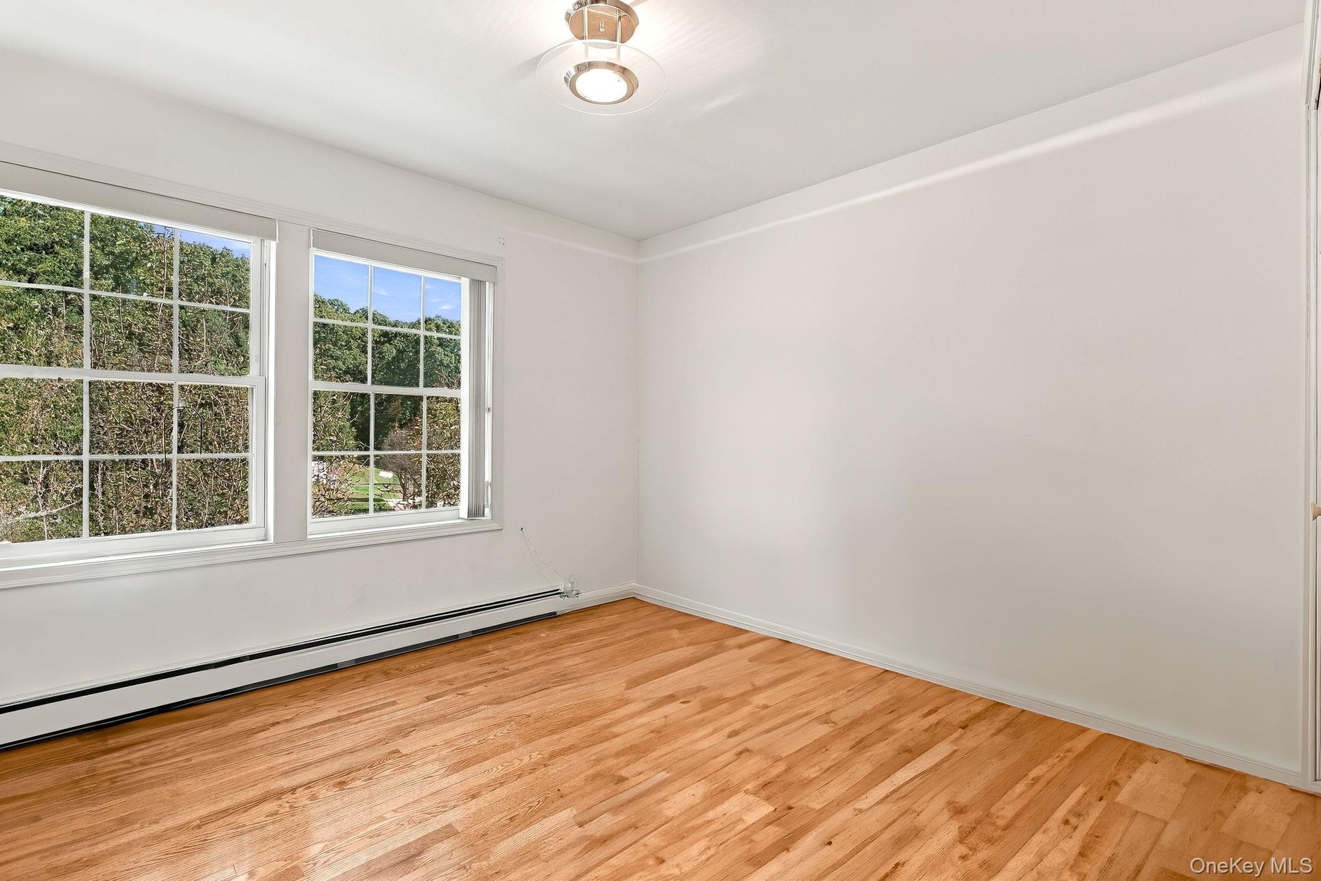 Bedroom three is at the end of the hall, front of the house.