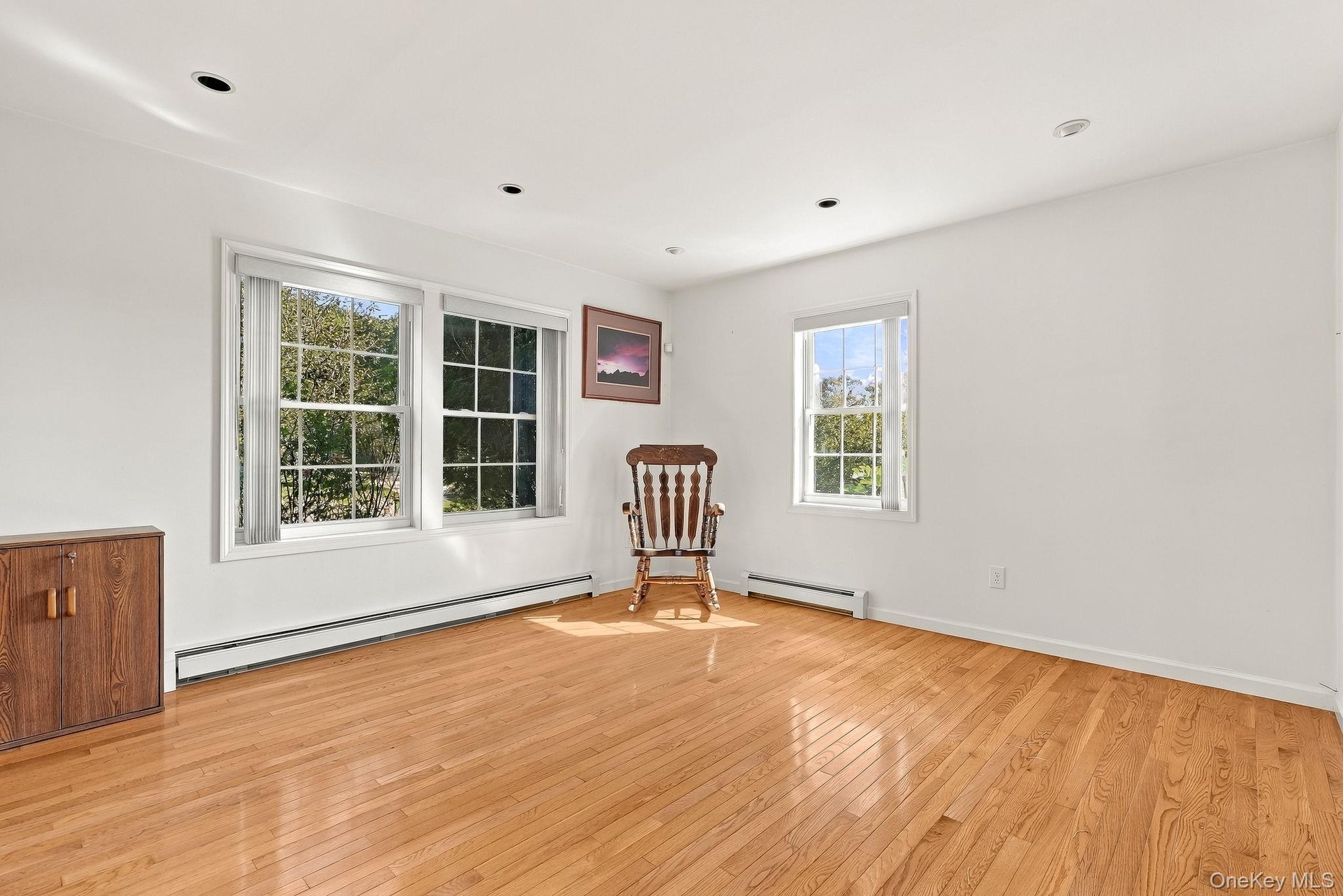 Gleaming hardwood floors can be found throughout the home. There is no lack of warmth or light.