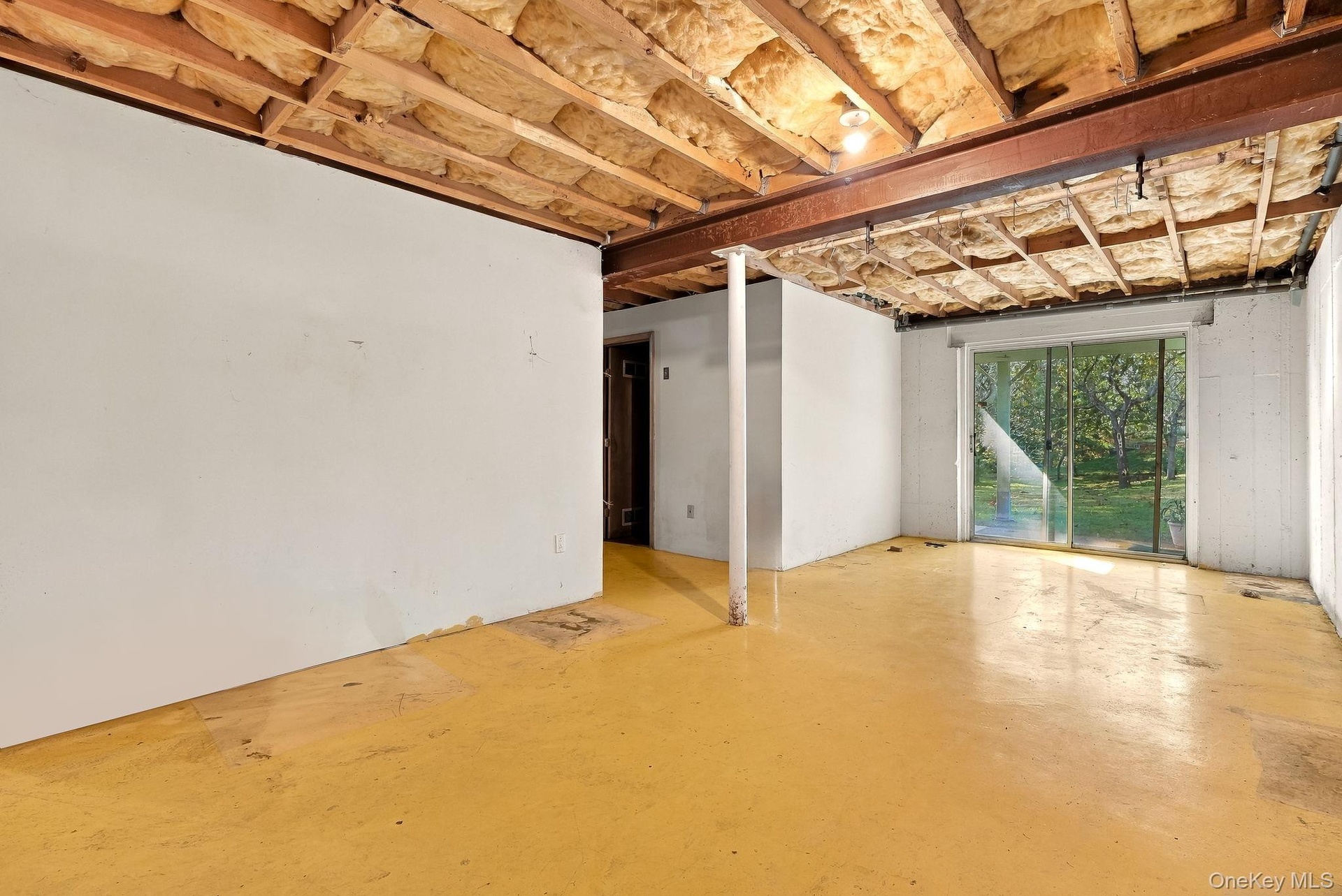 Sliders to the back yard - and your laundry/boiler room complete the space.