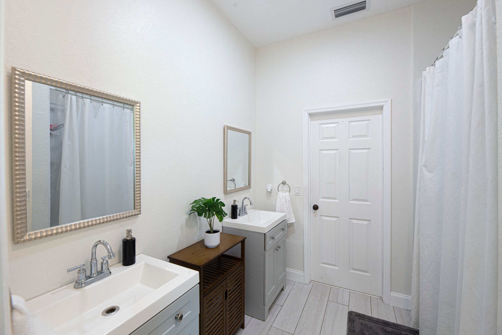 Bathroom with vanity and shower