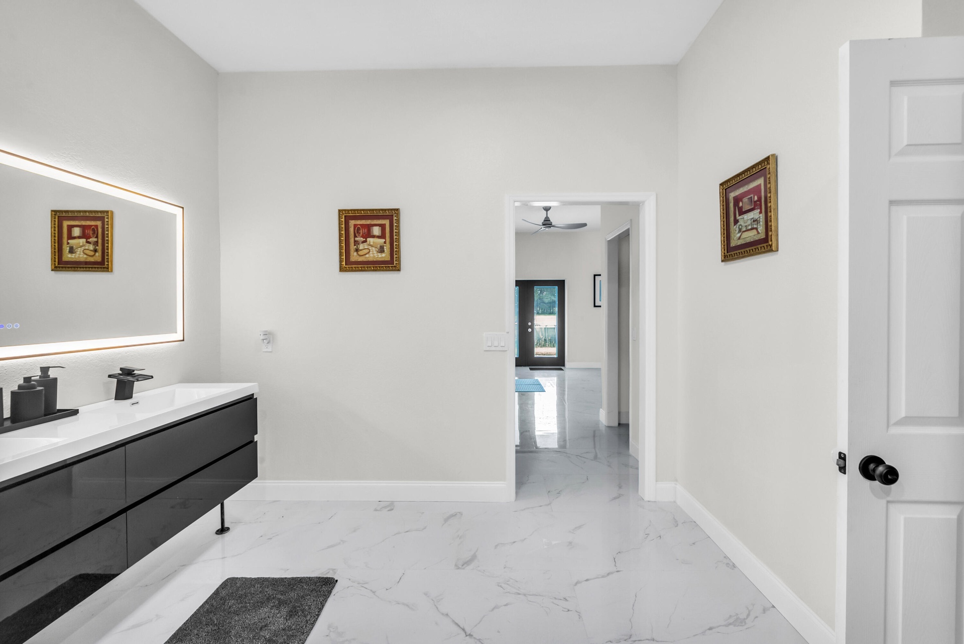 Primary bath with double vanity and lighted mirror